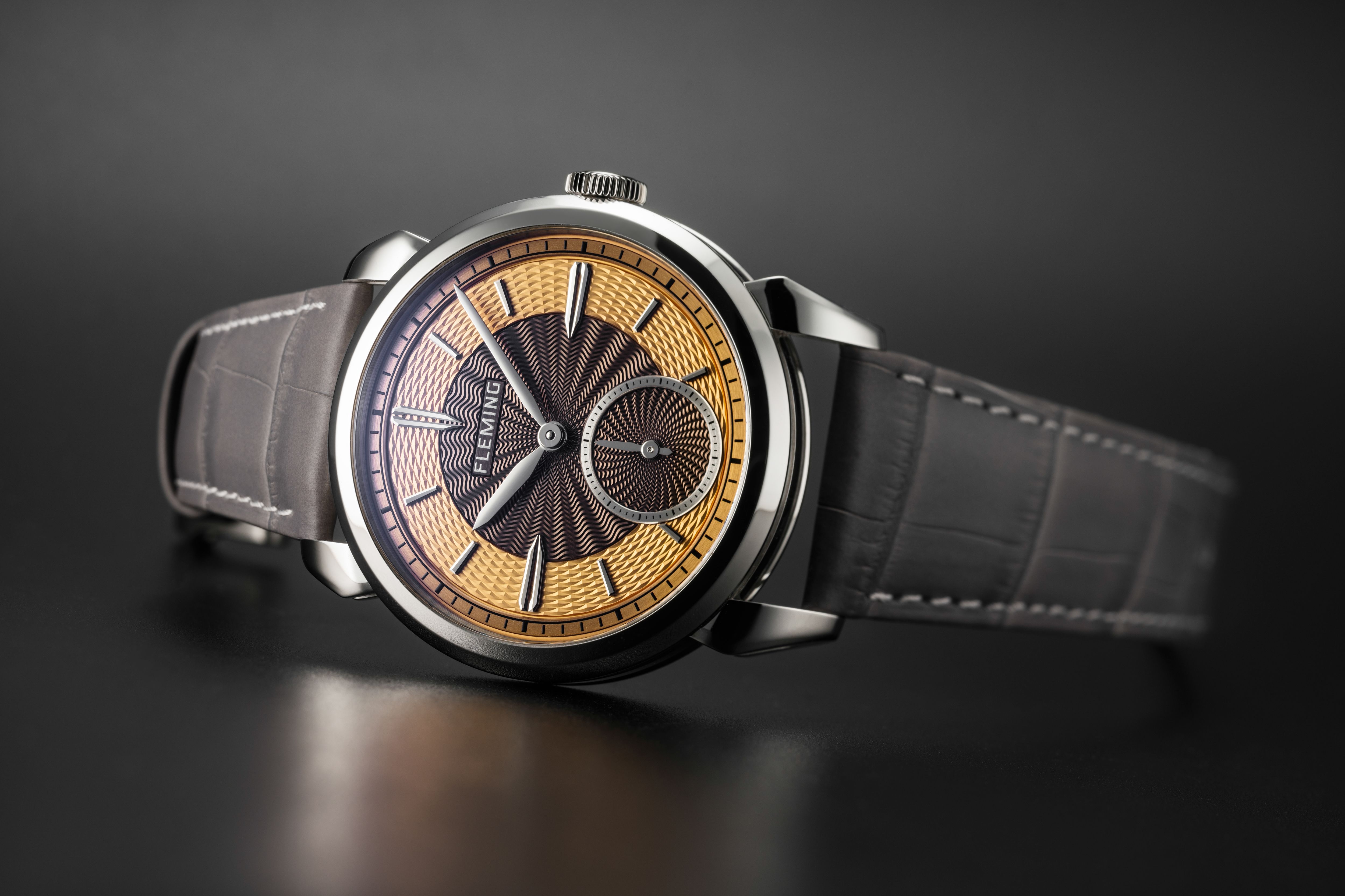 A luxury watch with a gold face 