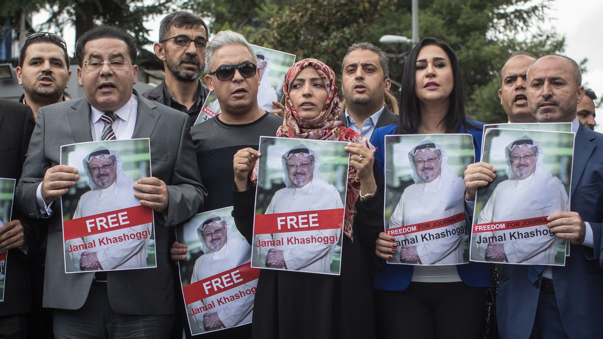 Nobel Prize winner Tawakkol Karman (5th-L) holds a poster of Saudi journalist Jamal Khashoggi during a protest outside Saudi Arabia's consulate on October 8, 2018 in Istanbul, Turkey.