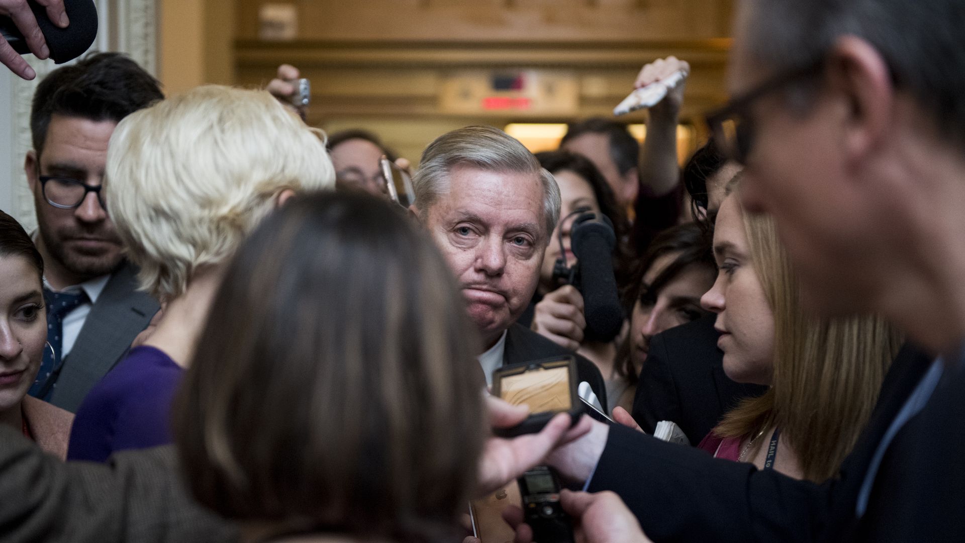 Senator Lindsey Graham talks to reporters