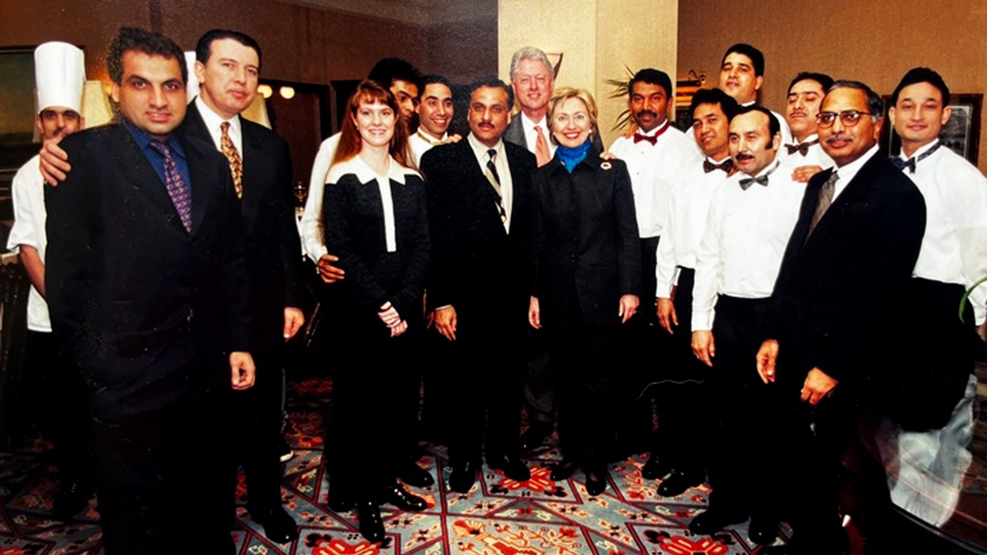 A photo from 1993 with President Clinton, Hillary Clinton, and Ashok Bajaj and team at the Bombay Club