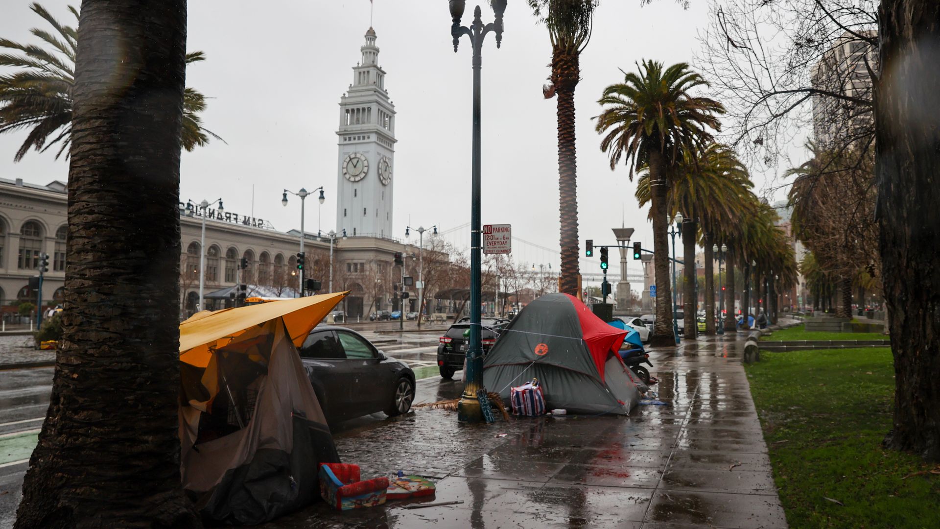Photo of tents lining a sidewalk across the street from the Ferry Building in San Francisco