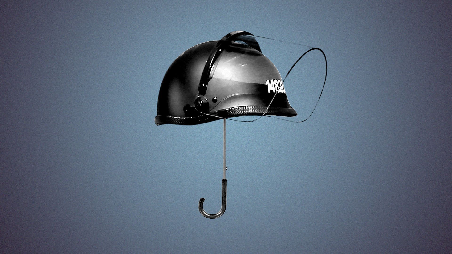 A police riot helmet with a face shield on an umbrella.