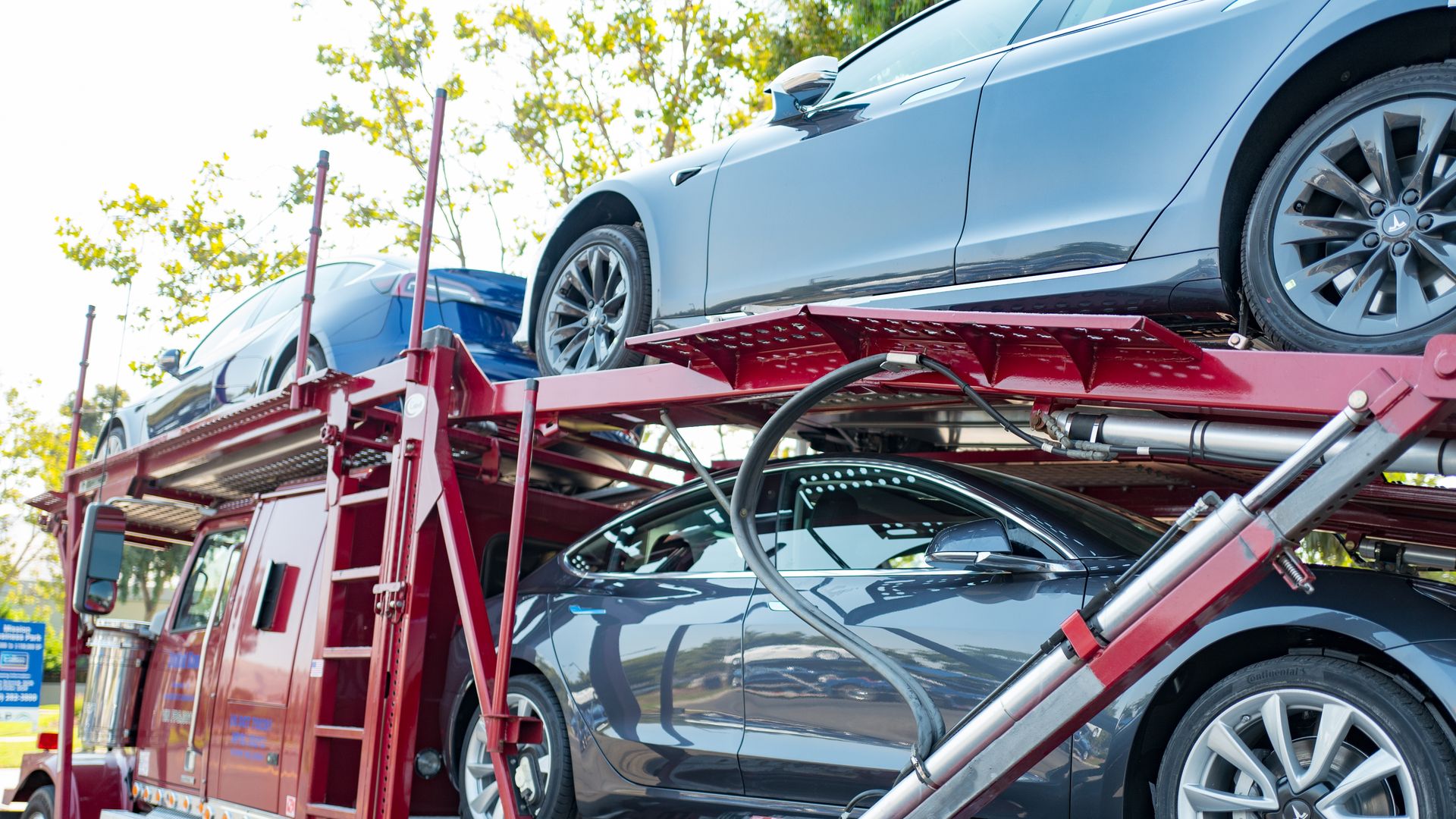 Photo of Teslas on a car carrier ready to be delivered