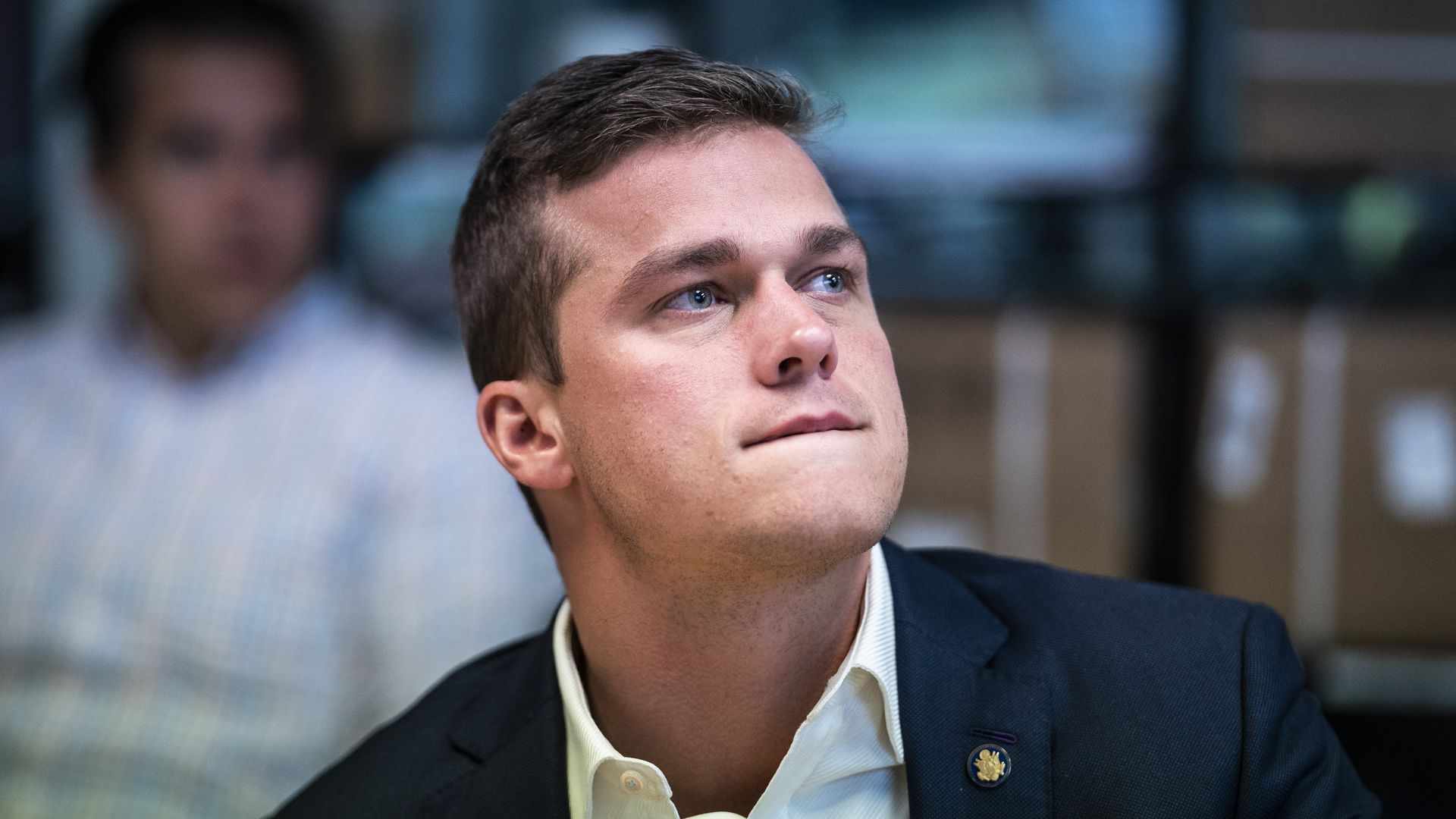 Rep. Madison Cawthorn, wearing a blue suit and white shirt.