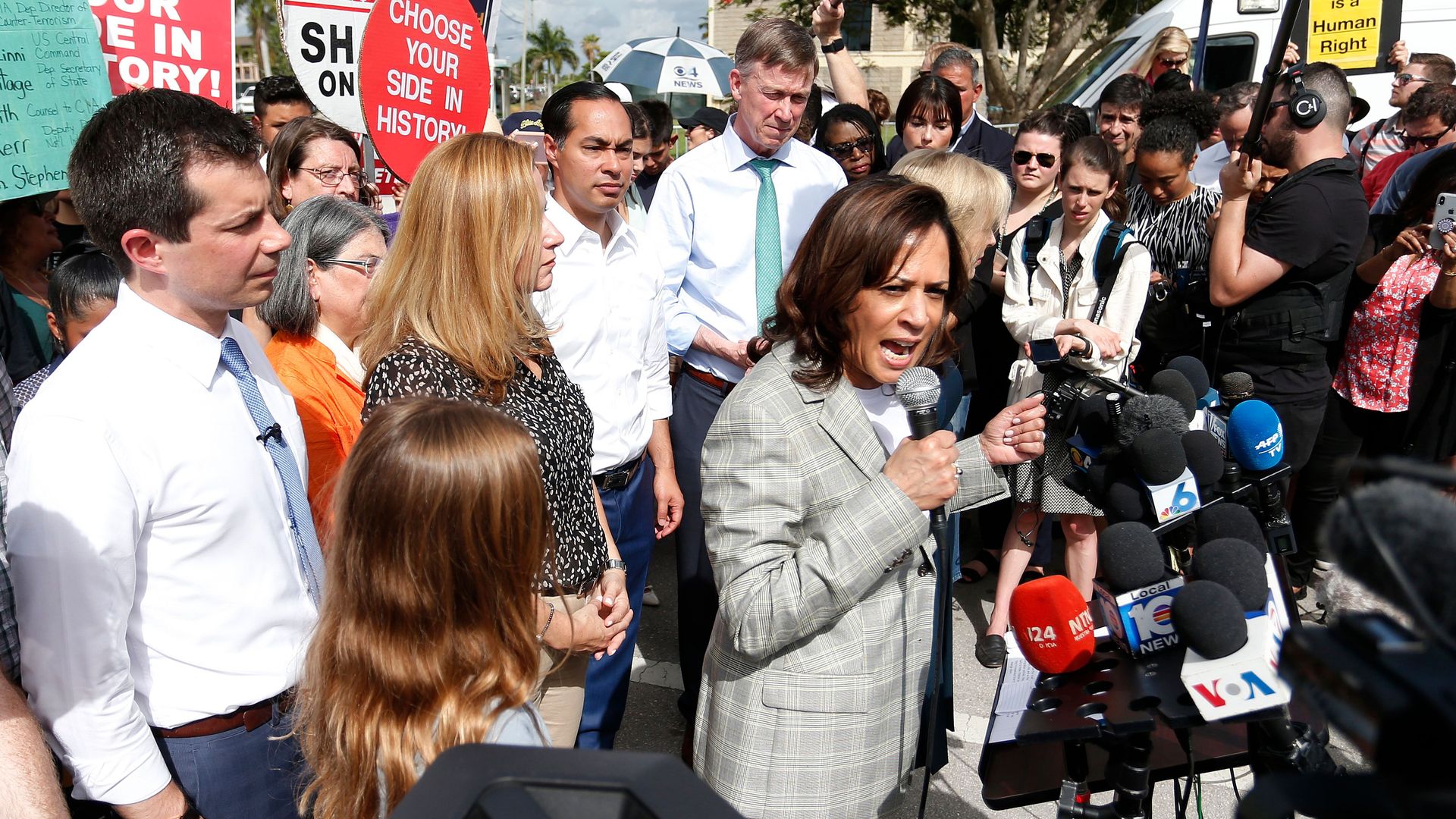 Kamala Harris and other then-presidential candidates are seen speaking outside a child detention center in Homestead, Fla., in June 2019.