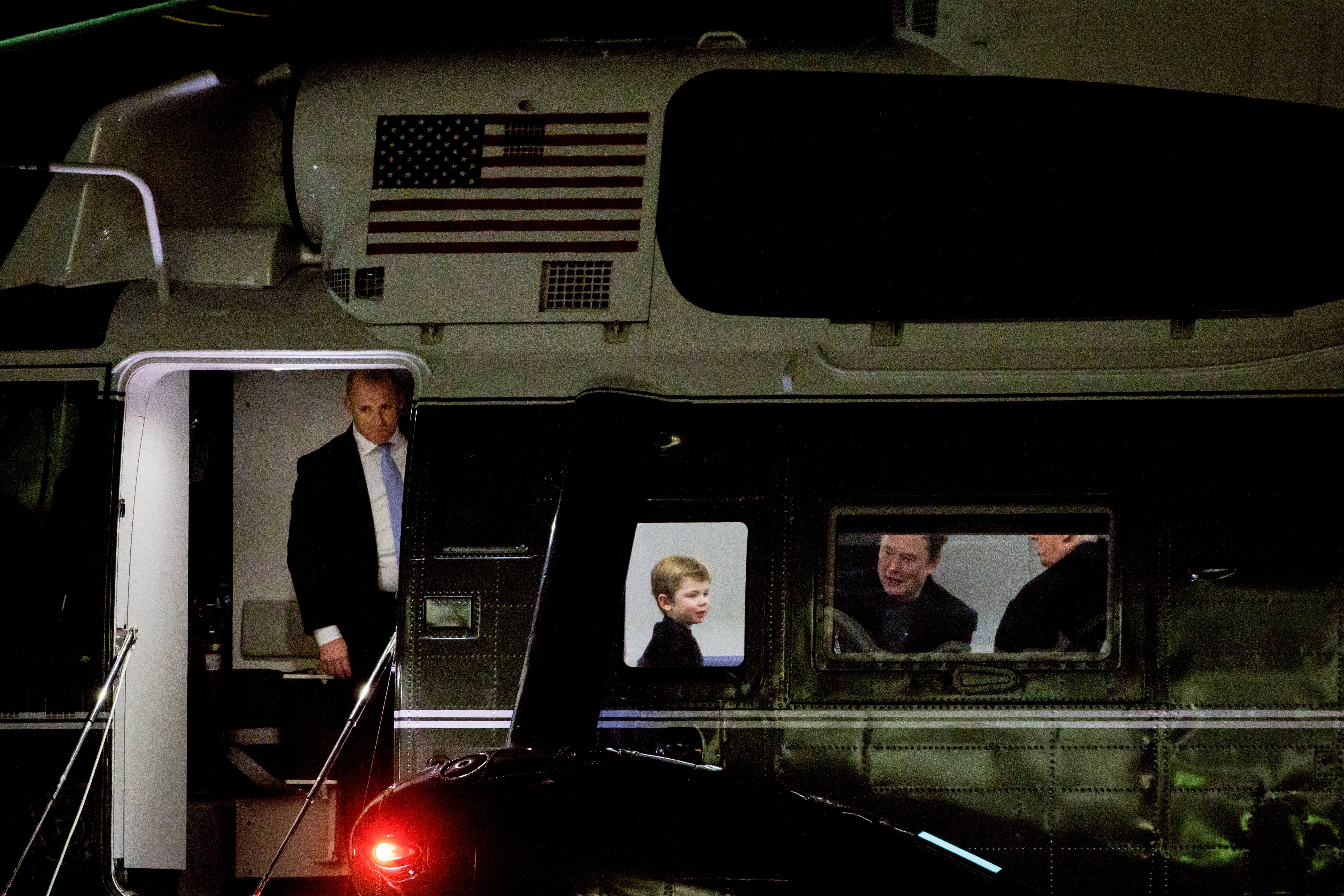 President Trump, Elon Musk and Musk's son on Marine One after it landed on the South Lawn on Sunday.