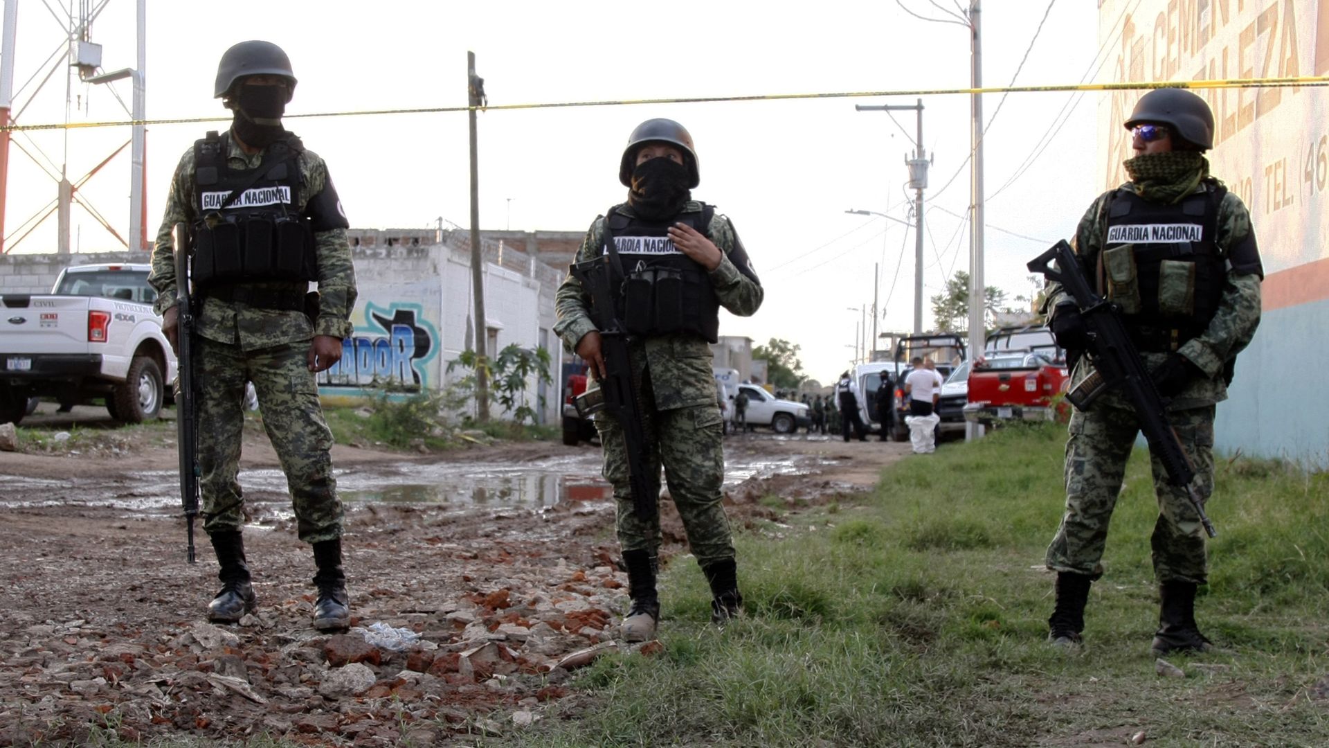 Two Mexican national guardsmen remain near the crime scene where 24 people were killed in Irapuato, Guanajuato state, Mexico.