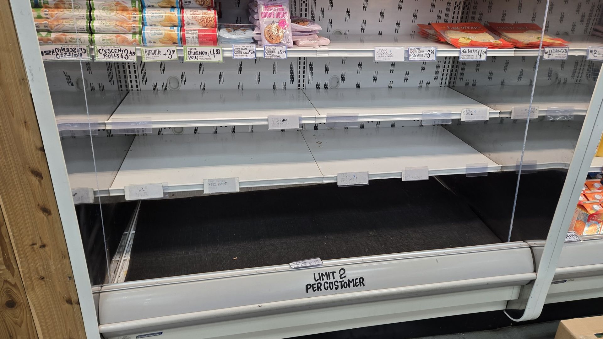 Empty shelves where eggs are normally stocked.