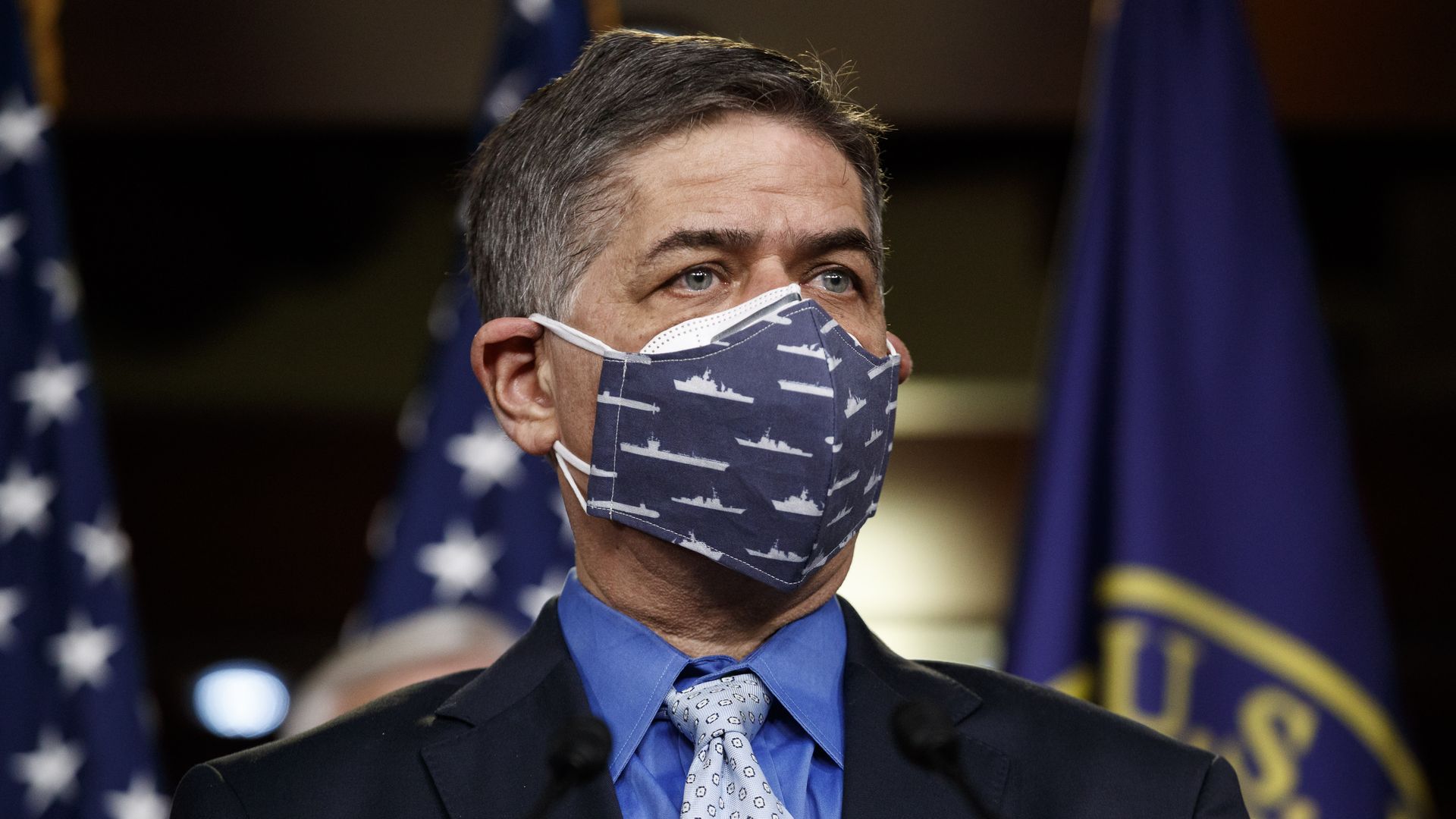 Rep. Filemon Vela of Texas is seen wearing a COVID mask during a news conference.