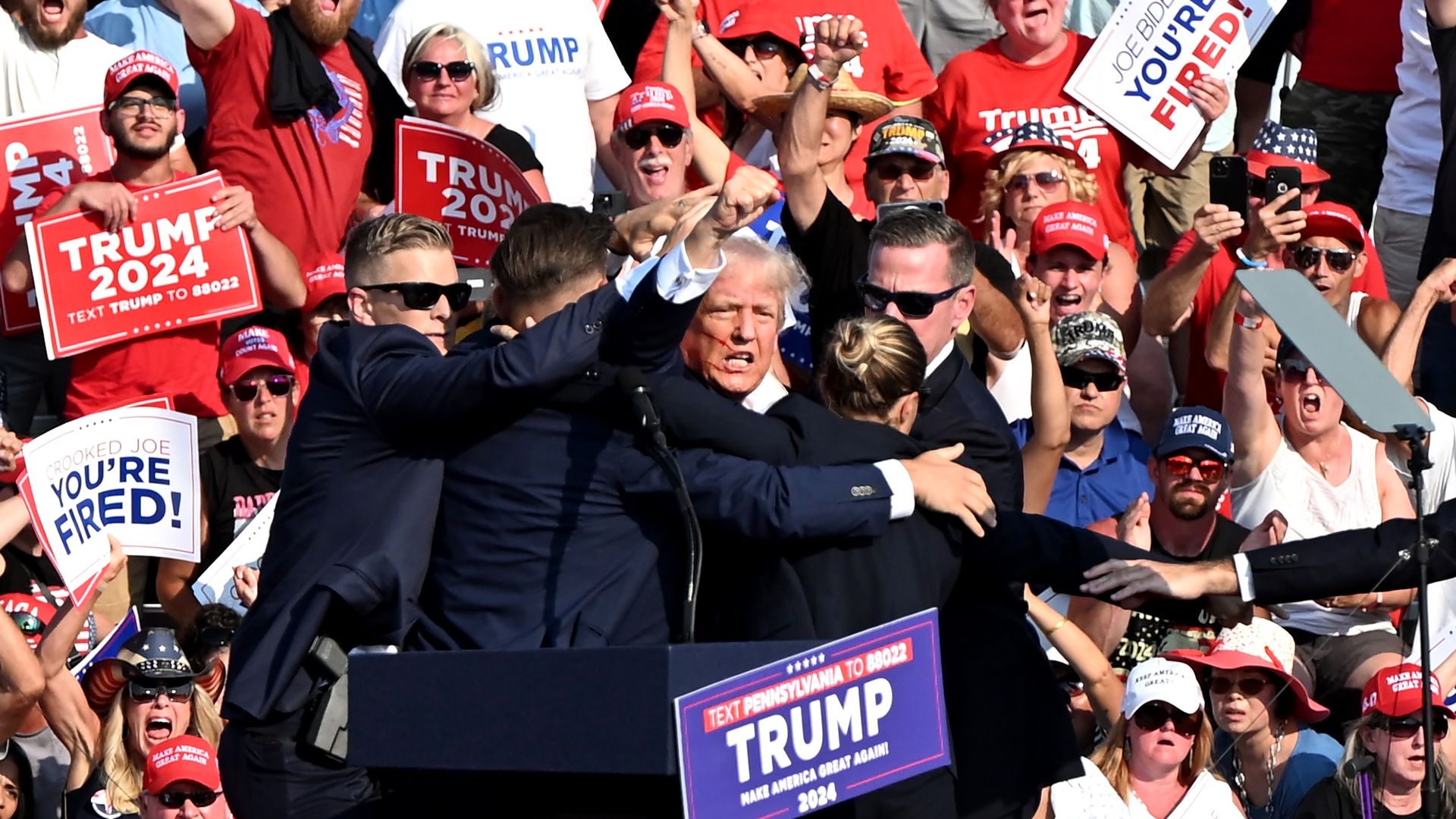 President Donald Trump is surrounded by Secret Service agents during a campaign event at Butler Farm Show Inc. in Butler, Pennsylvania, US, on Saturday, July 13, 2024.