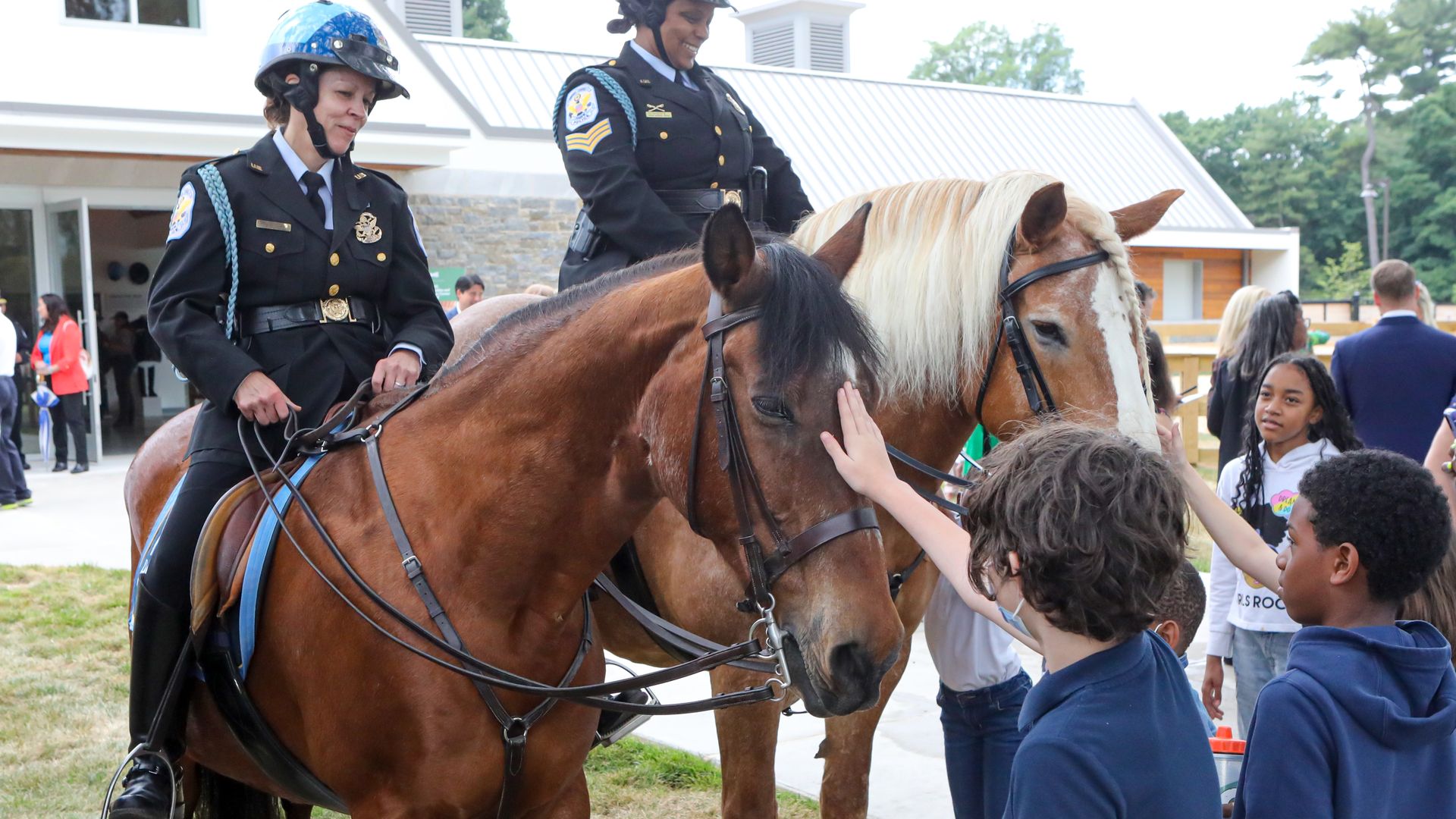 The Mounted Park Police and horses visit with kids on the National Malll