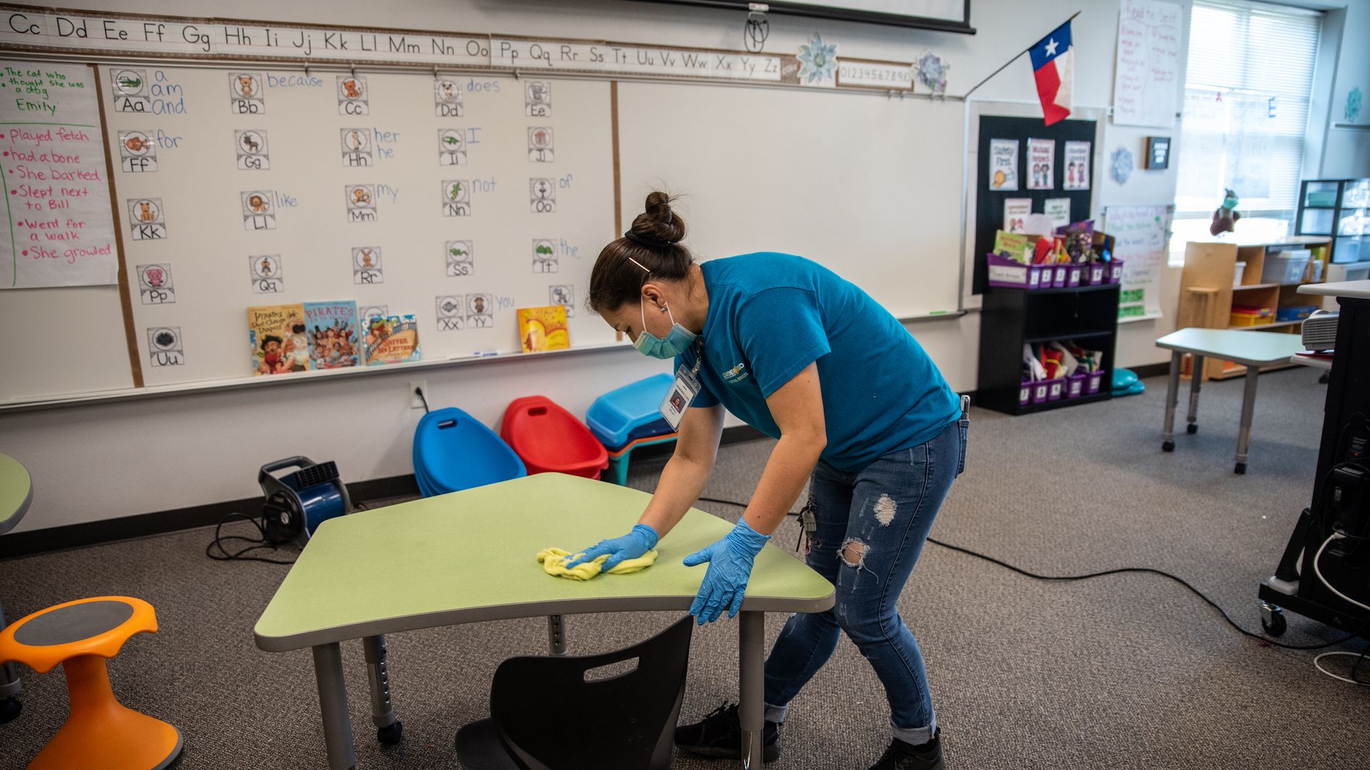 A custodial worker cleans a classroom in Leander.