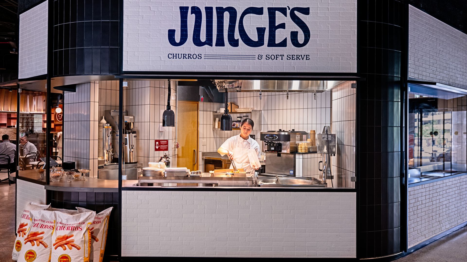 A churro and soft serve stand at The Square food hall