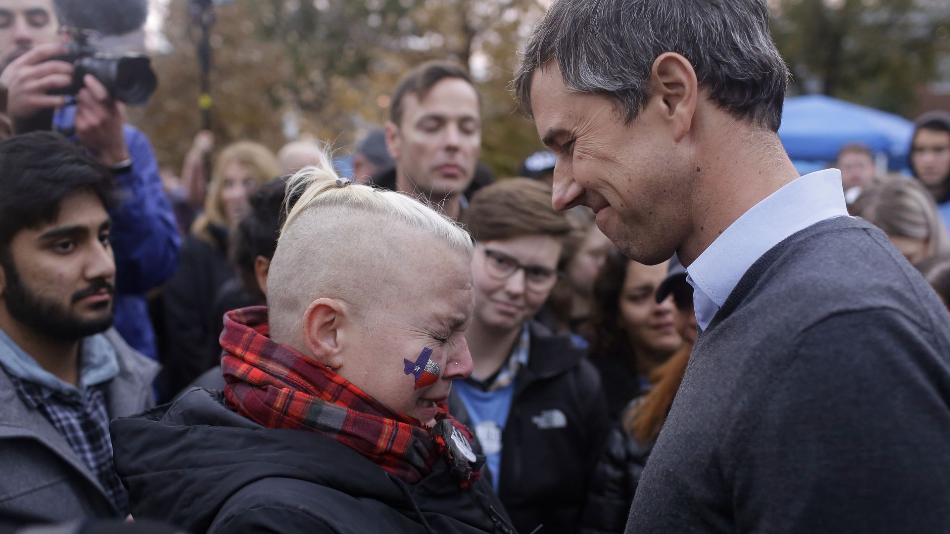 Beto O'Rourke consoles a crying fan.