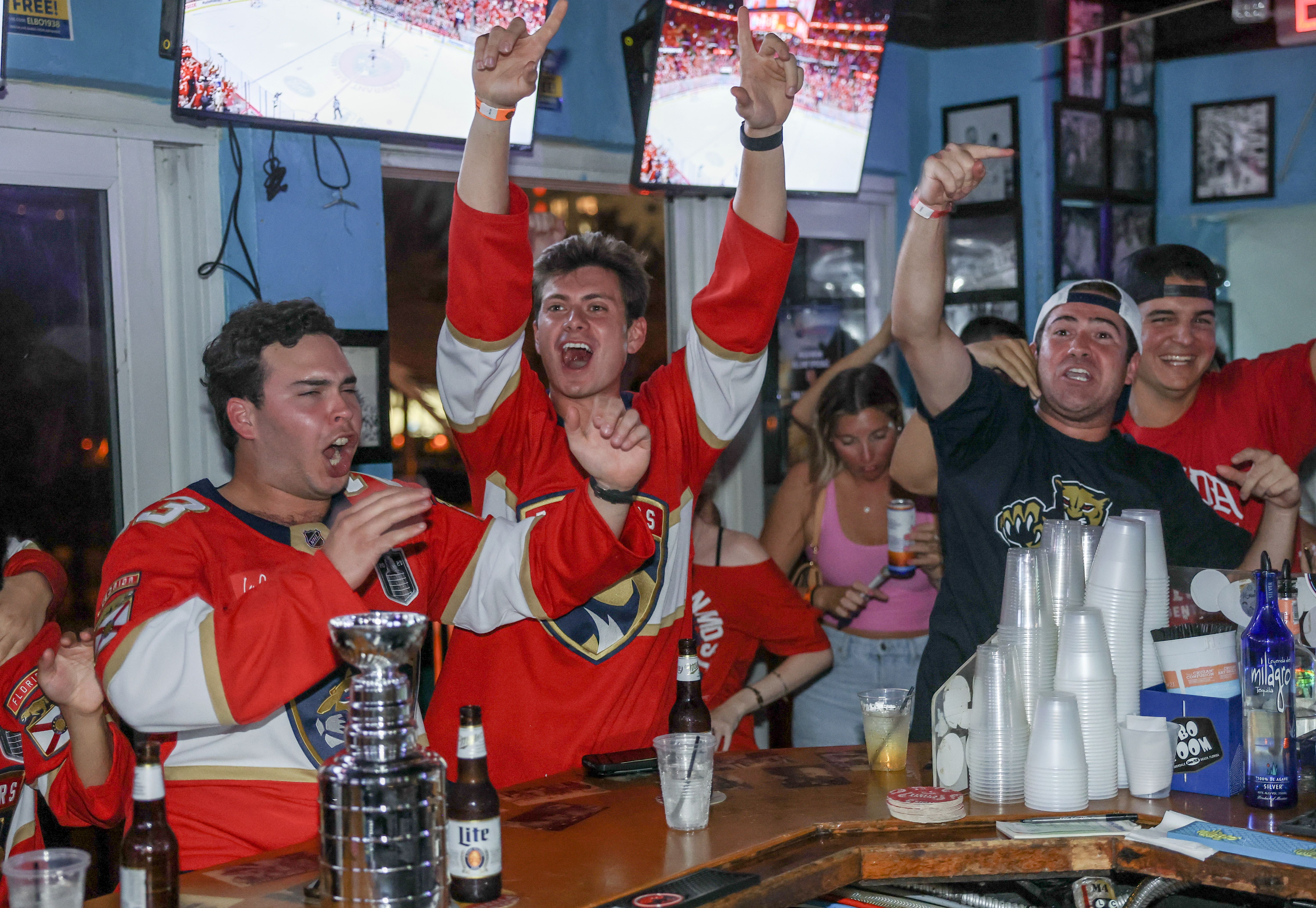 FORT LAUDERDALE, FLORIDA - JUNE 17: Florida Panthers fans react as they watch on television the Florida Panthers and Edmonton Oilers play in Game Six of the 2025 Stanley Cup Final at the Elbo Room on June 17, 2025 in Fort Lauderdale, Florida. The Panthers would become the third team in the 21st cent