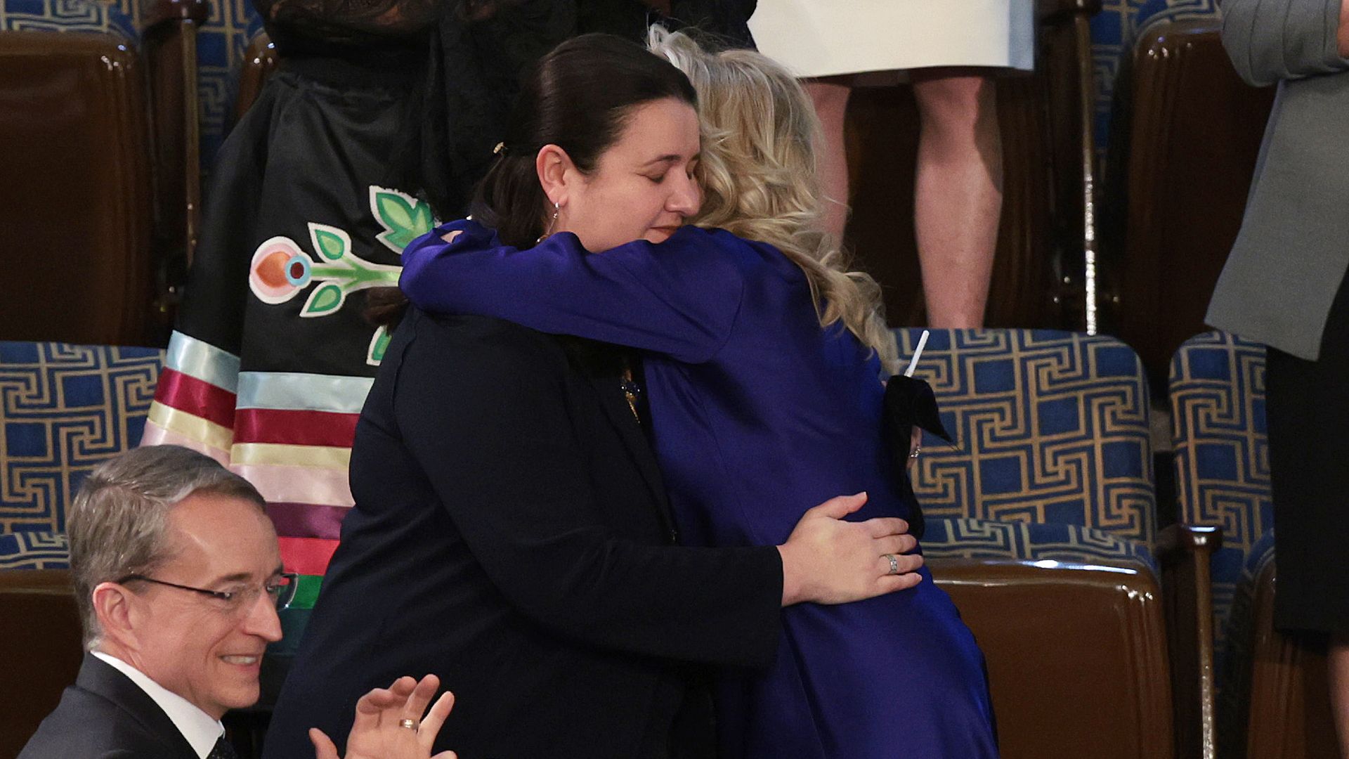 Ukrainian Ambassador to the United States Oksana Markarova (L) is embraced by First Lady Jill Biden during U.S. President Joe Biden's State of the Union address