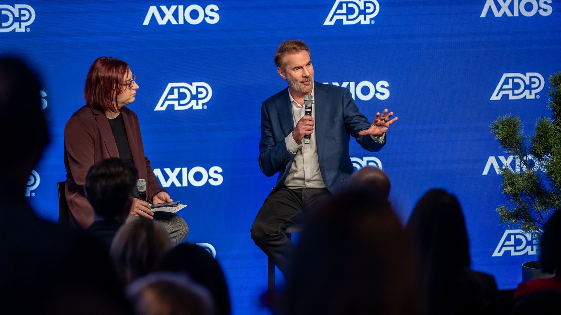 Stanford Institute for Human-Centered AI (HAI) senior fellow Erik Brynjolfsson appears on stage at Axios House in Davos with Ina Fried.