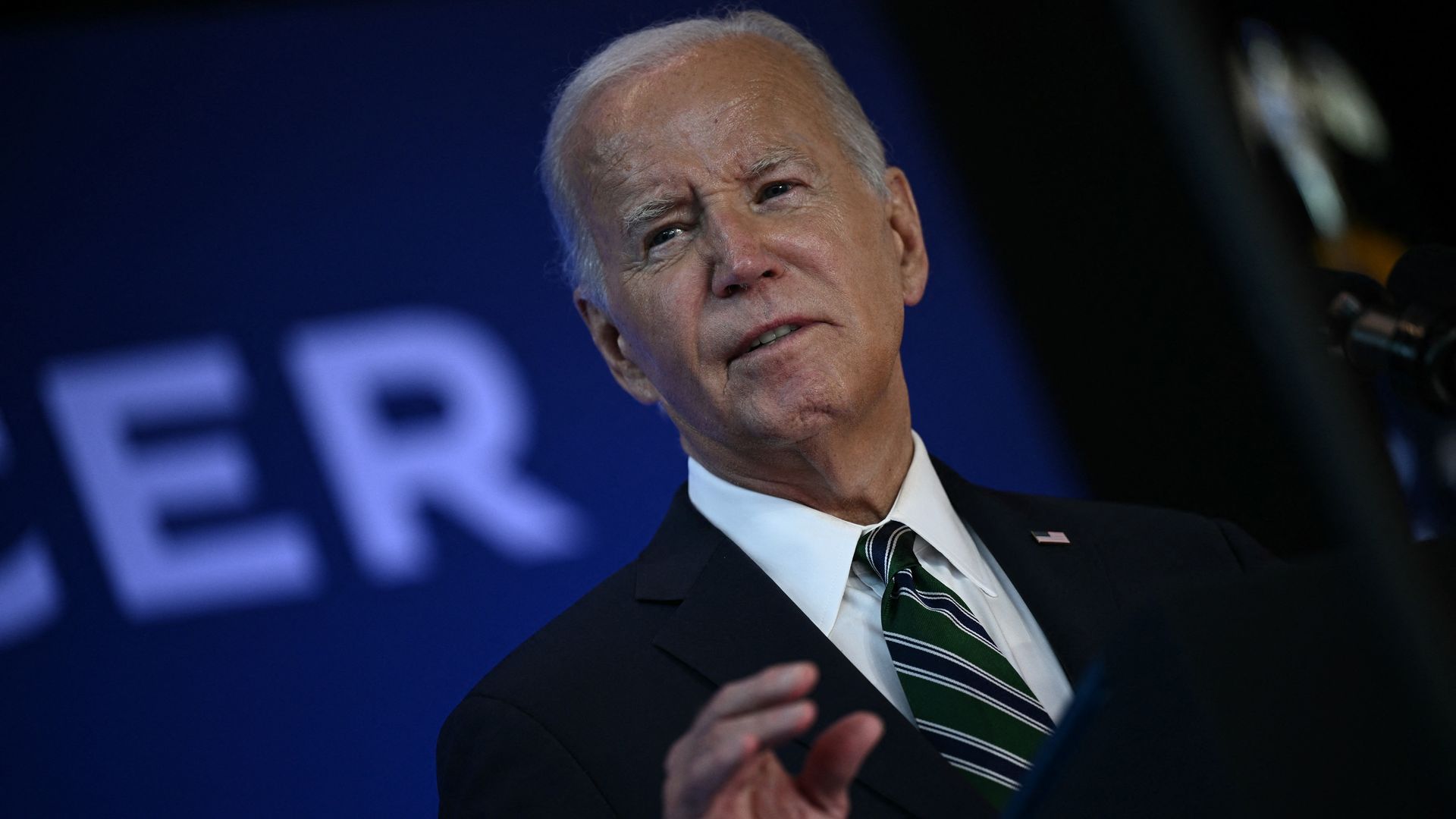 Photo shows President Joe Biden talking on stage in New Orleans.