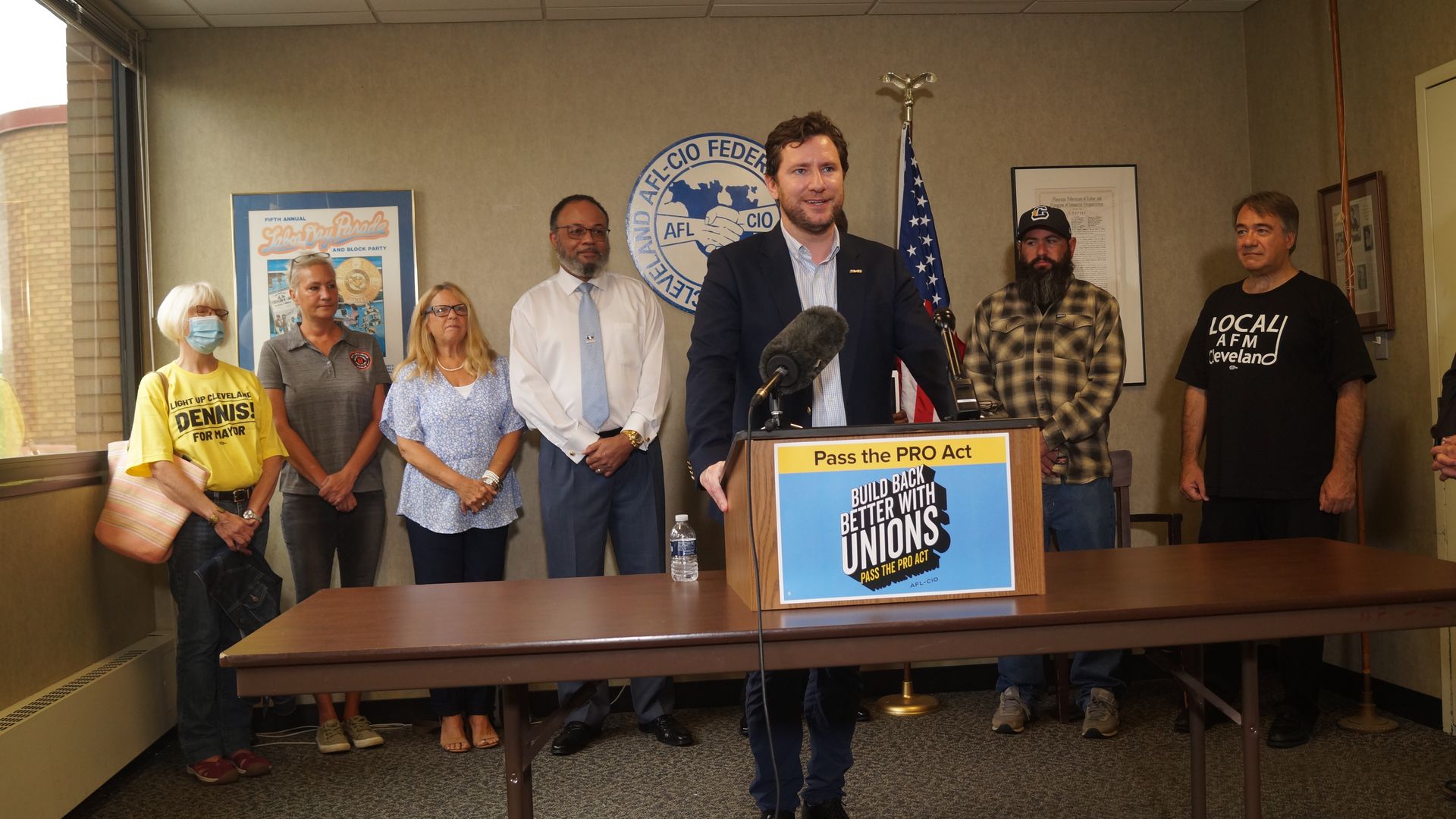 Dan O'Malley, backed by Cleveland labor leaders at a makeshift lectern