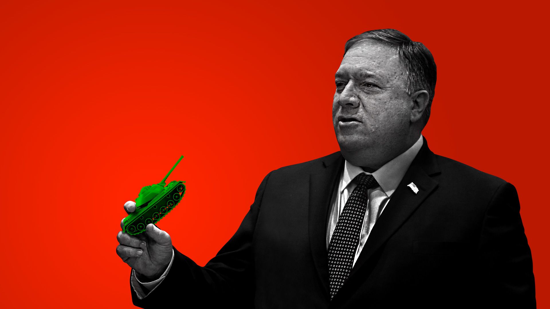 Mike Pompeo holding a miniature tank