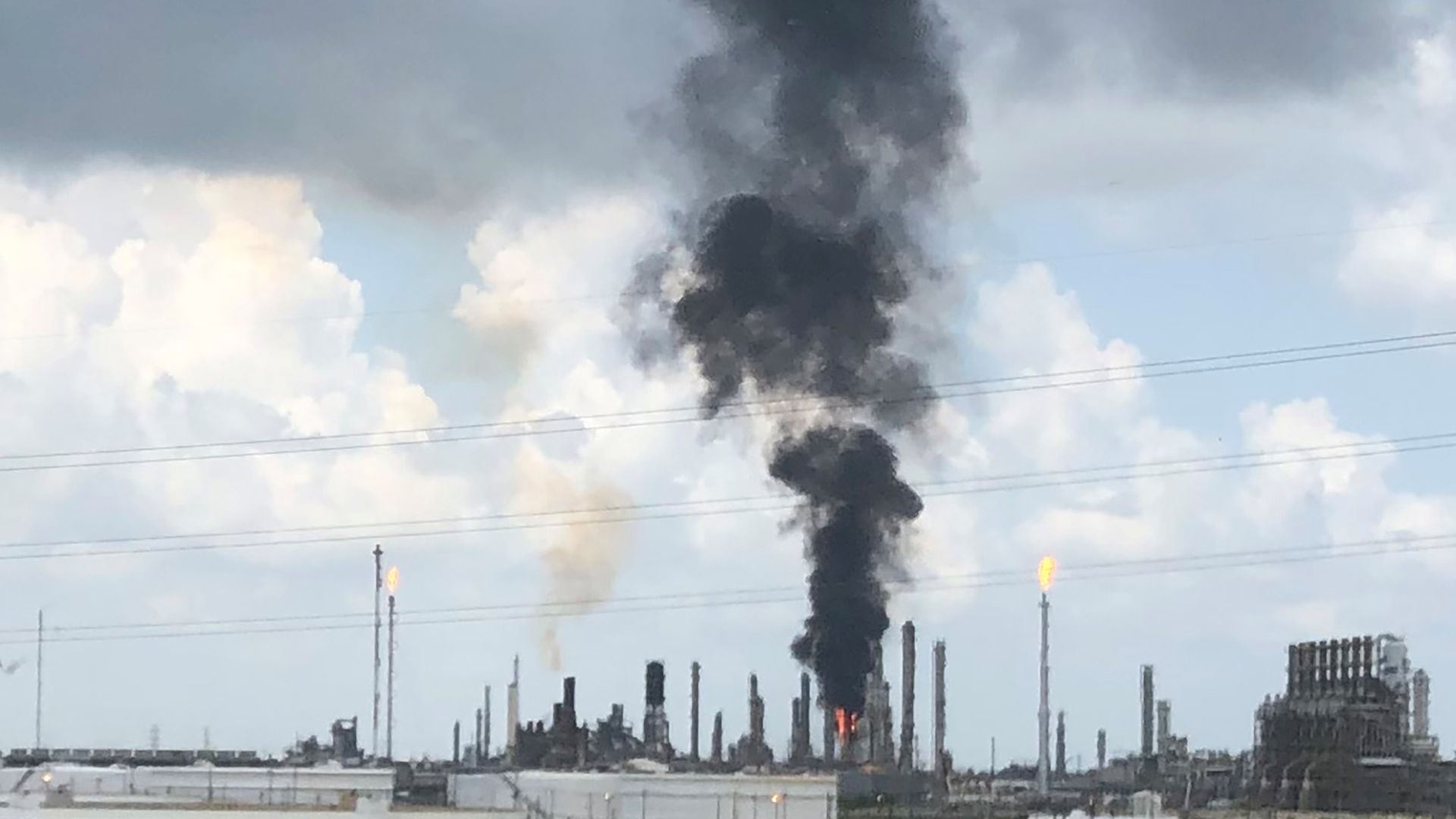 Smoke rises from a fire at Exxon Mobil's refining and chemical plant complex in Baytown, near Houston, Texas.