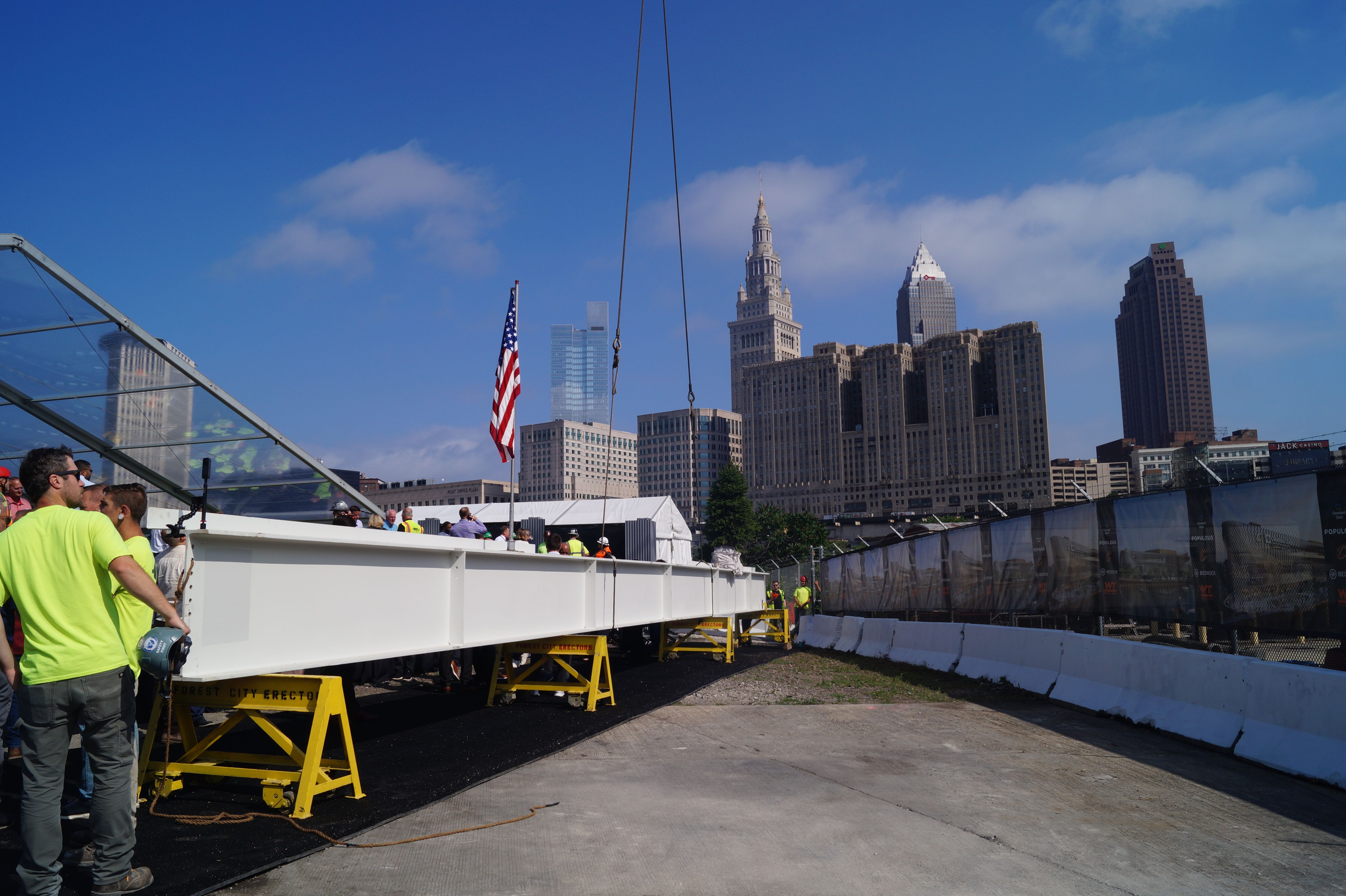 A white steel beam with Cleveland in background