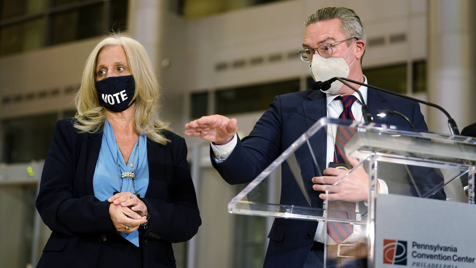 Philadelphia City Commissioners Al Schmidt, right, and Lisa Deeley speak to the media as election workers process ballots for the general election
