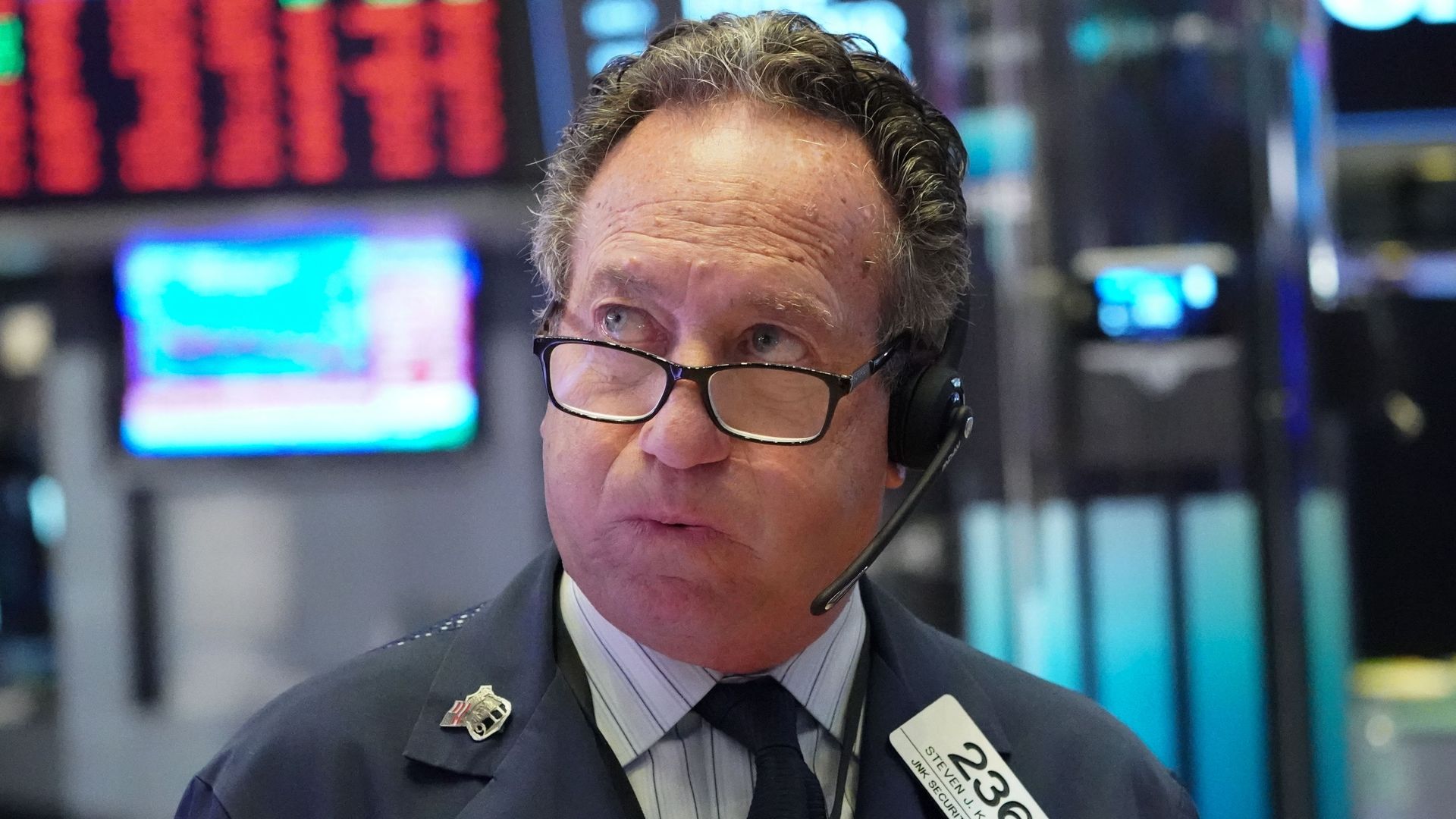 Trader works on the stock exchange floor at the closing bell