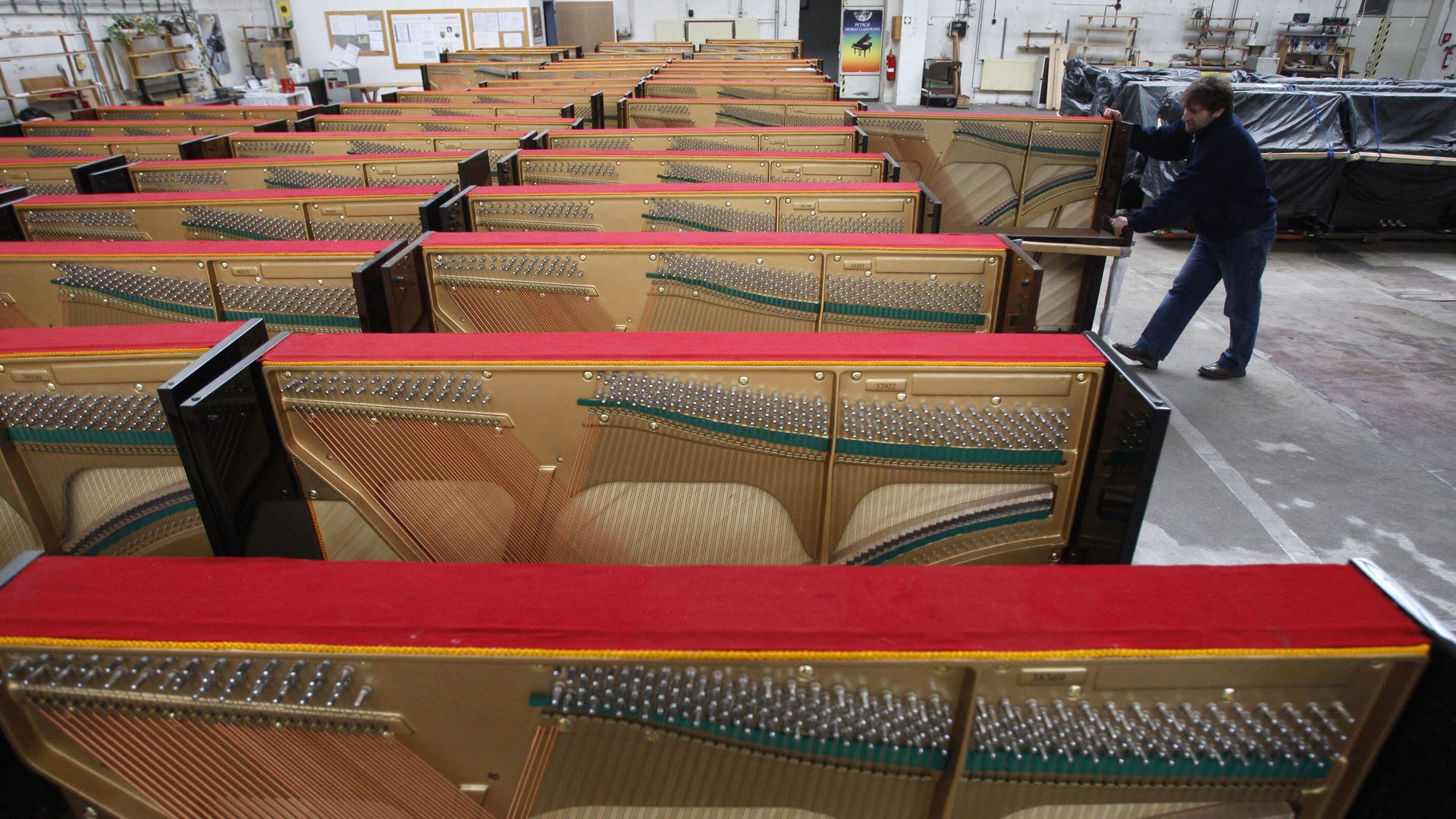 person moving pianos