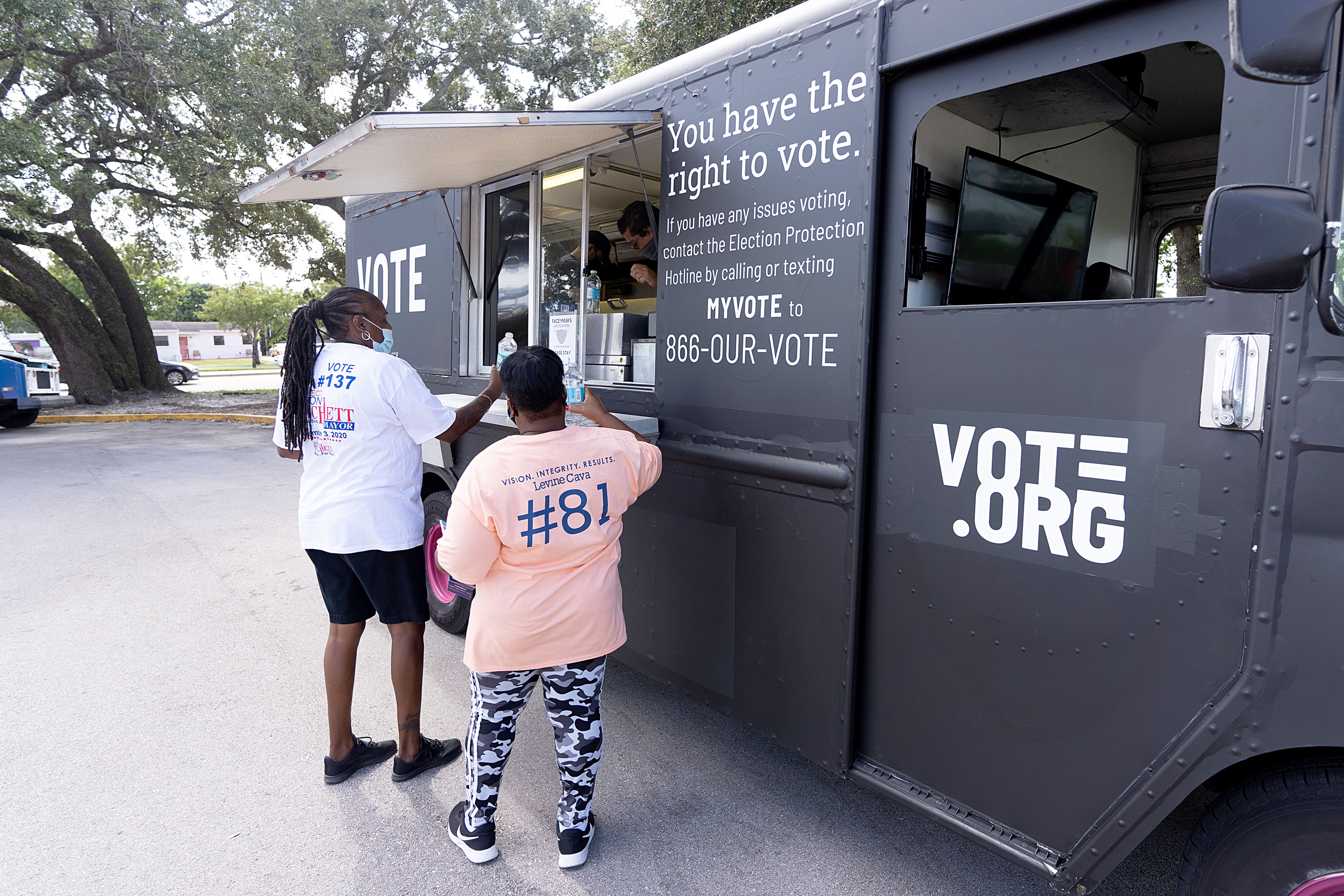 Vote.org food trucks deliver tacos and water to Miami voters in line on Election Day on November 03