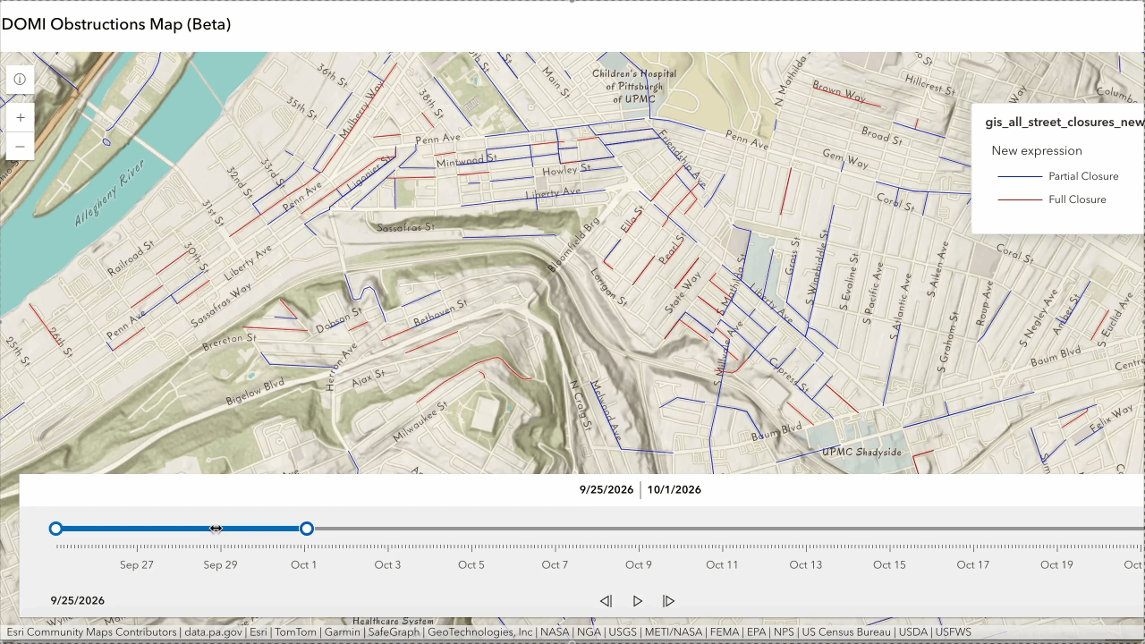 DOMI Obstructions Map (Beta) of Pittsburgh with blue lines for partial closures and red lines for full closures; legend on the right, Allegheny River to the left, and a bottom date slider.