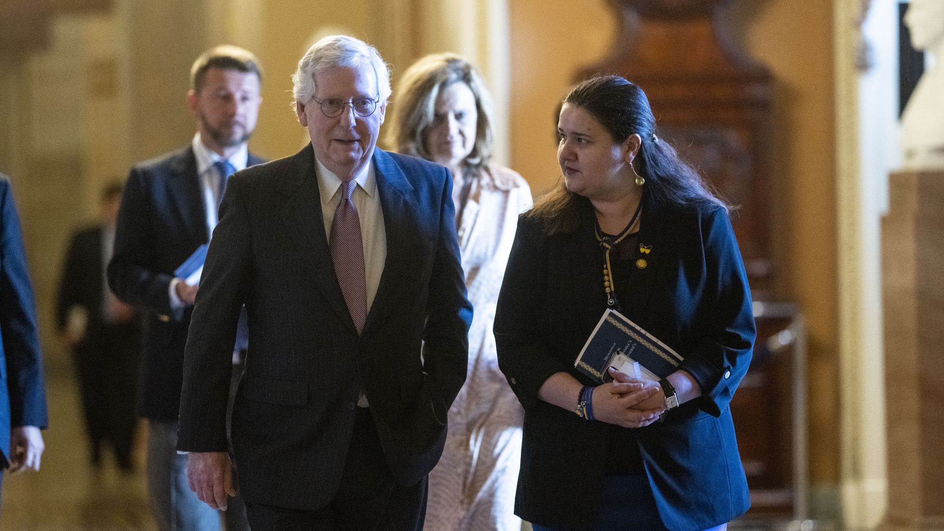 Ukraine's ambassador to the United States is seen walking with Senate Majority Leader Mitch McConnell.