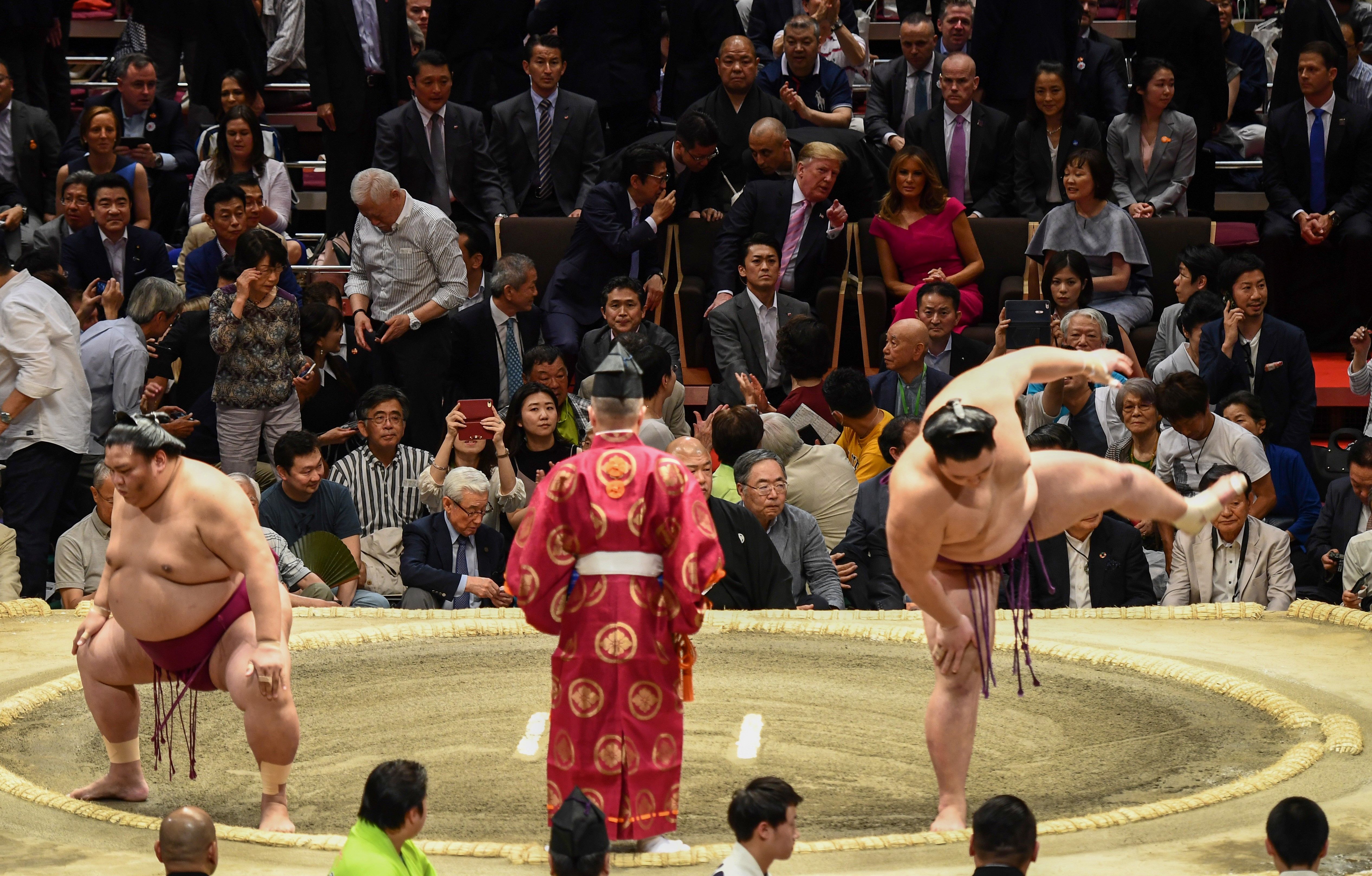 Trump and First Lady Melania Trump are accompanied by Japan's Prime Minister Shinzo Abe and his wife Akie Abe (centre row) during the Summer Grand Sumo Tournament in Tokyo on May 26, 2019.