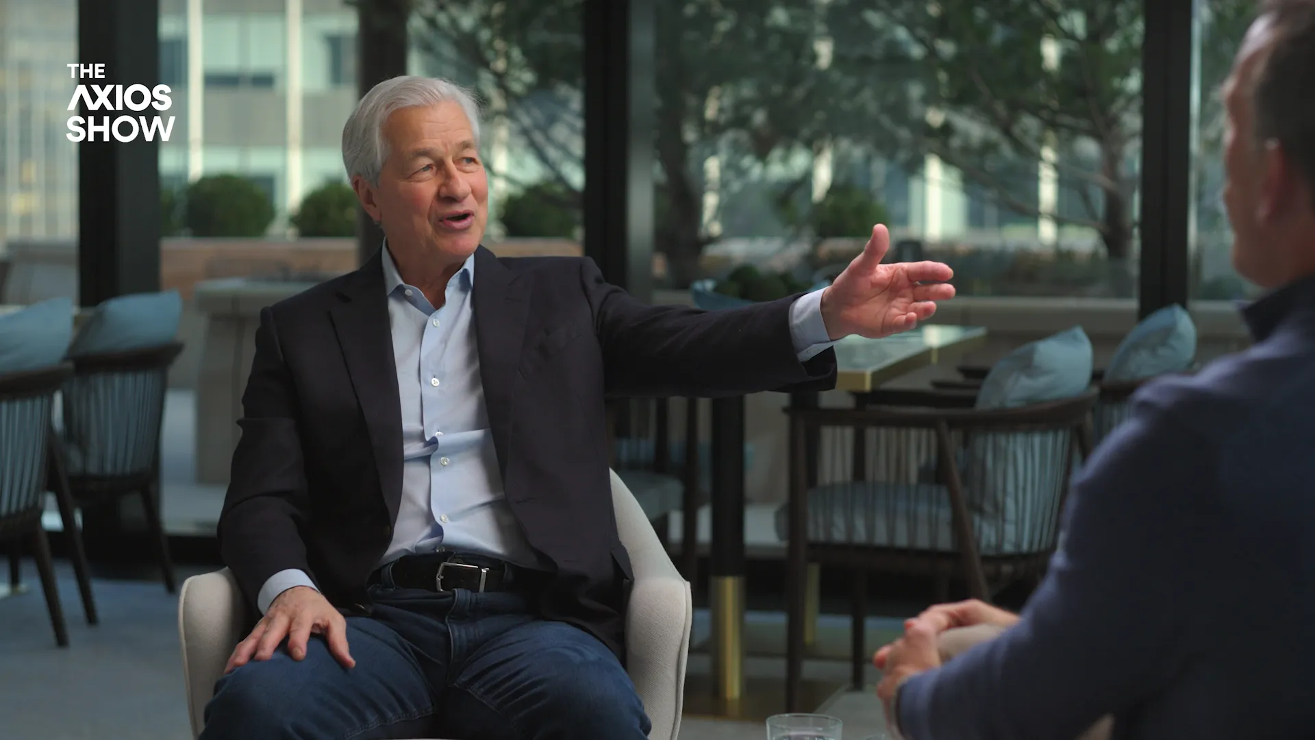Jamie Dimon gestures while speaking with Jim VandeHei on The Axios Show