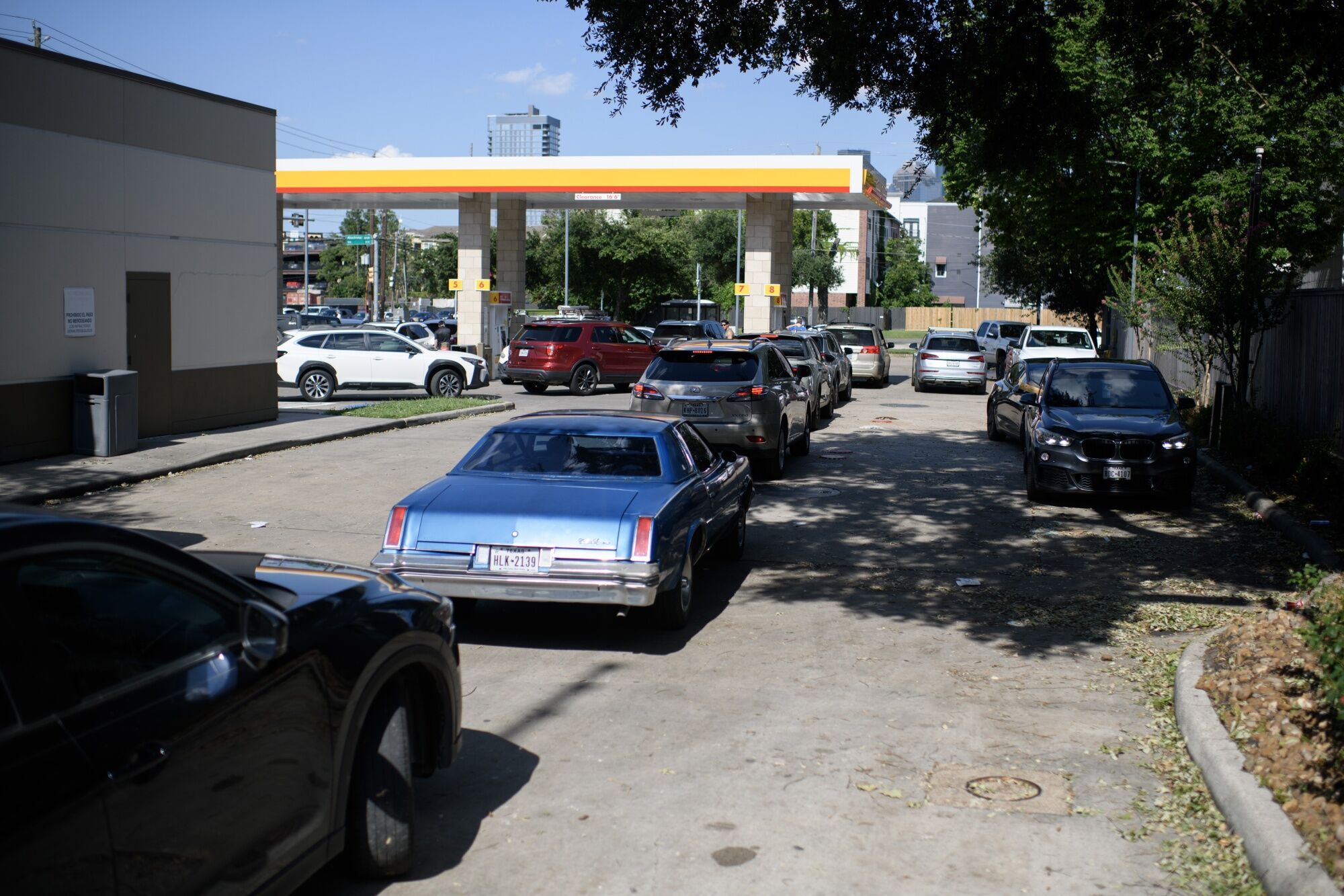 Vehicles line up at a gas station in Houston, Texas.