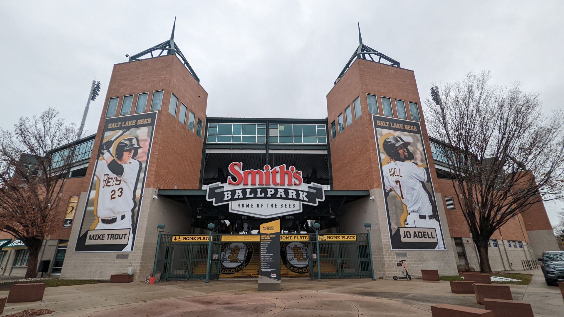 Towers at the entrance of a baseball stadium bookend a sign that reads "Smith's Ballpark."