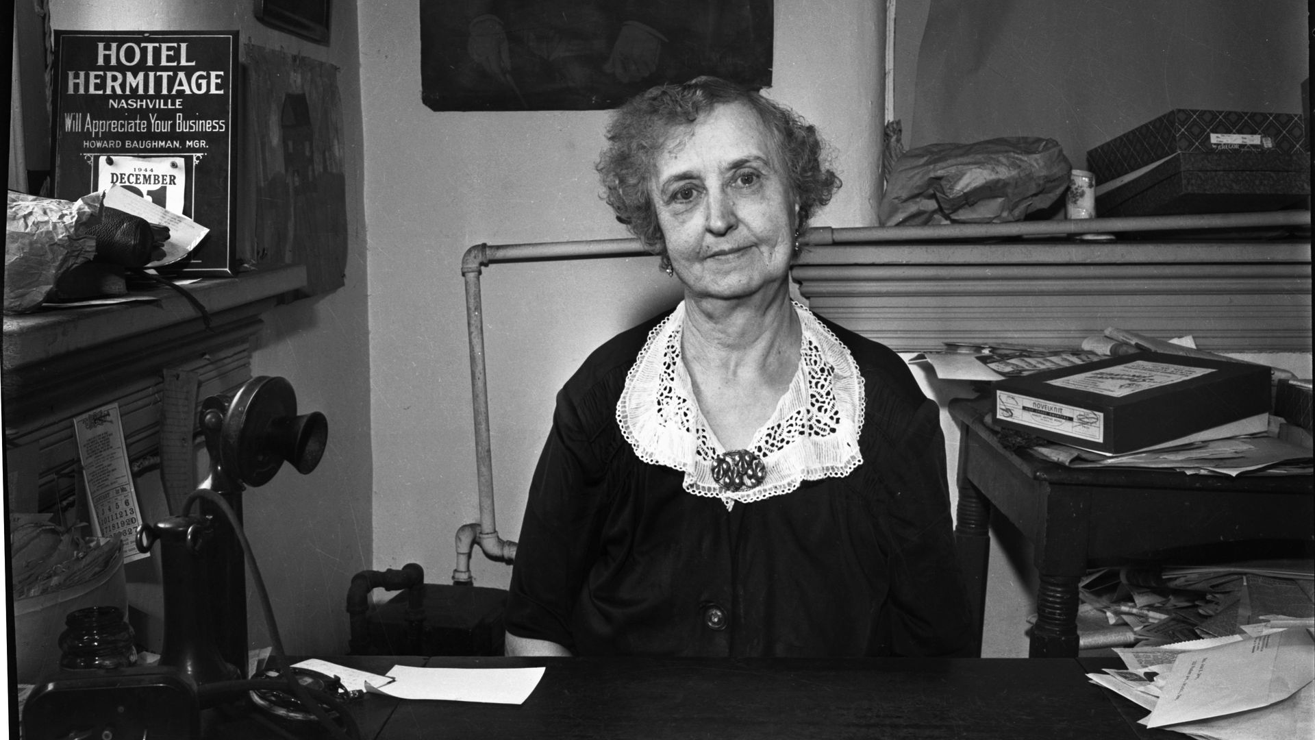 Lula Naff sitting at her desk.