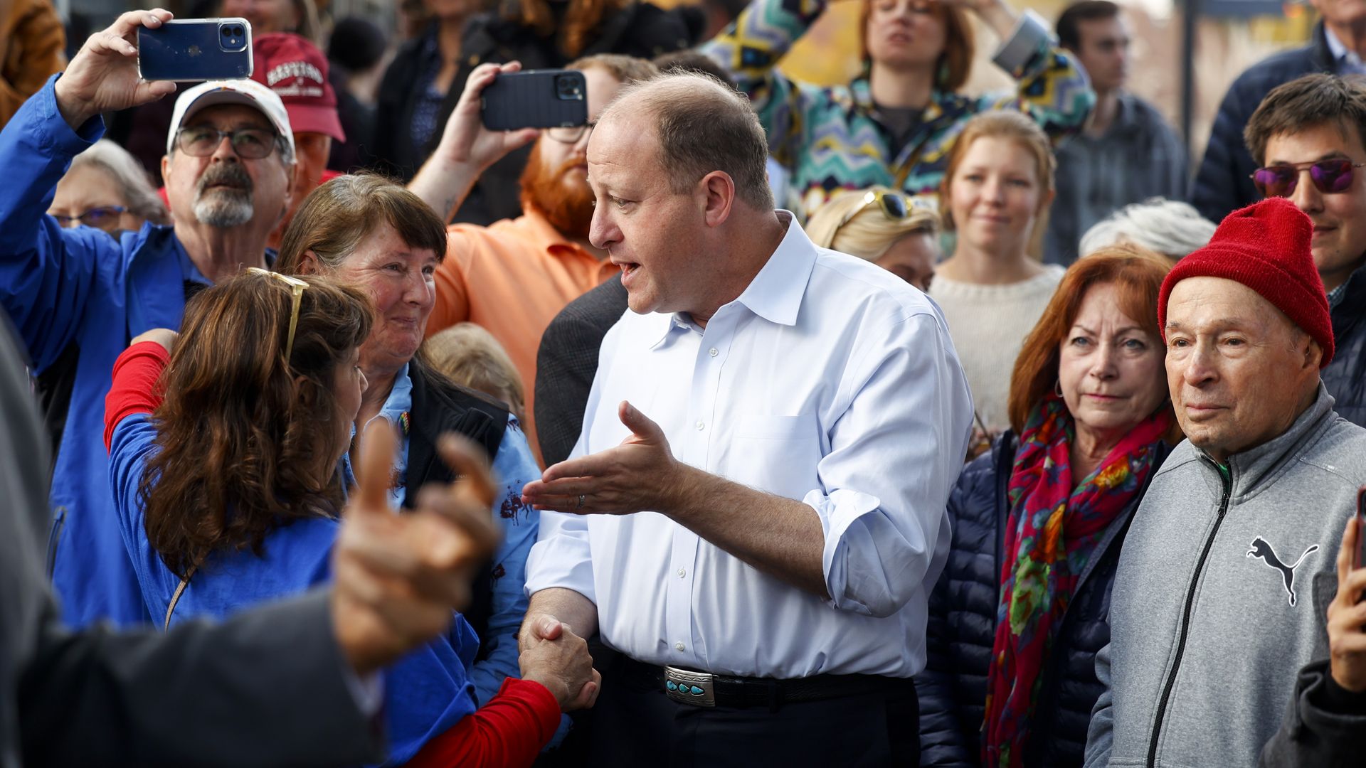 Gov. Jared Polis speaks to a supporter at an Oct. 26 rally in Golden, Colorado. Photo: Michael Ciaglo/Getty Images