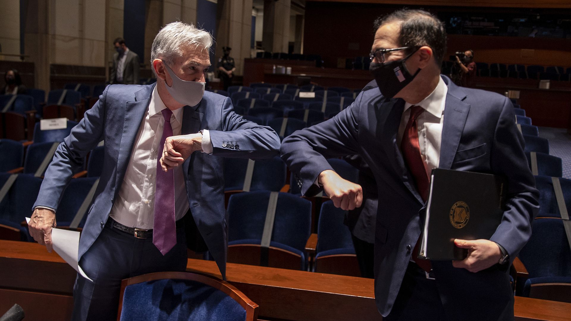 Powell and Mnuchin elbow-bumping
