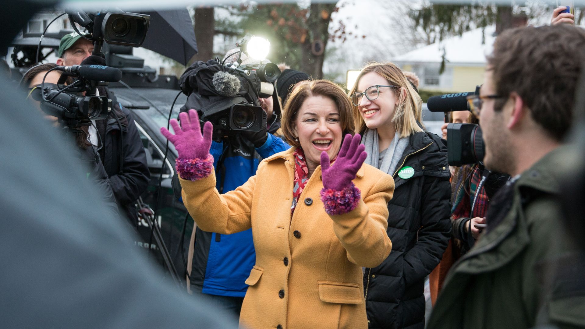 Amy Klobuchar waves to supporters
