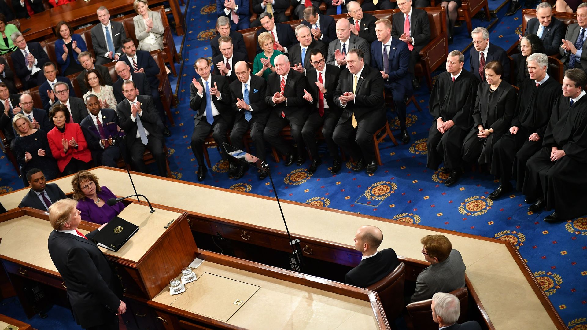 President Trump looks out at the House chamber as he delivers the State of the Union address
