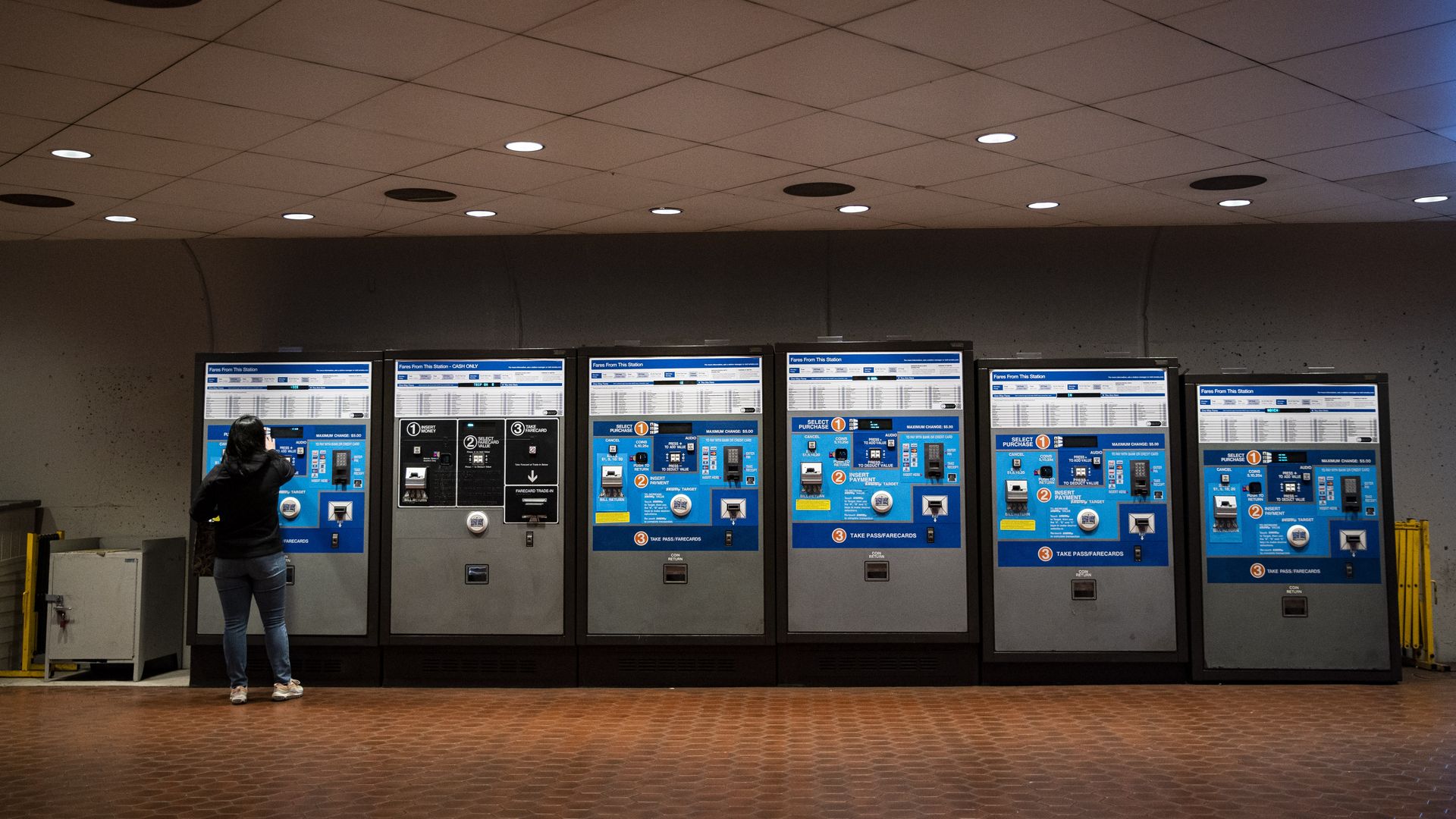 A commuter buys a metro card at the Metro Center station in Washington, D.C.