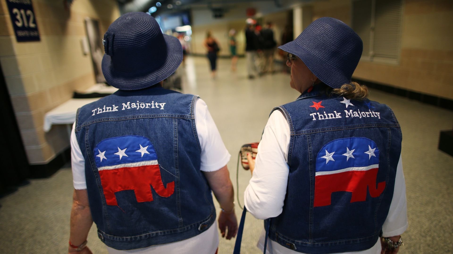 Two women don jean jackets with the GOP logo