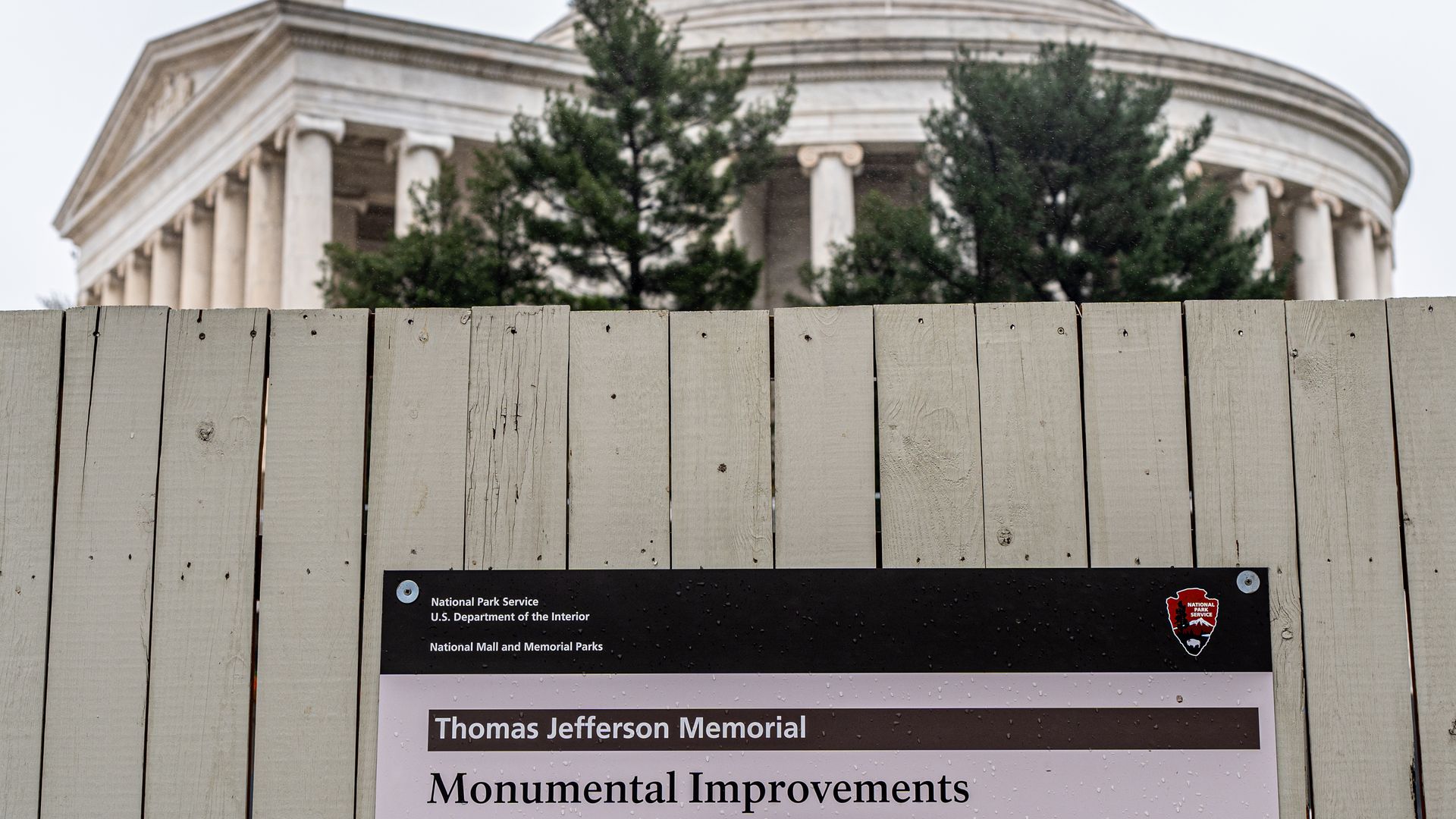 A photo of a sign reading "Jefferson Memorial: Monumental Improvements," with the Jefferson Memorial in Washington, D.C., in the background.