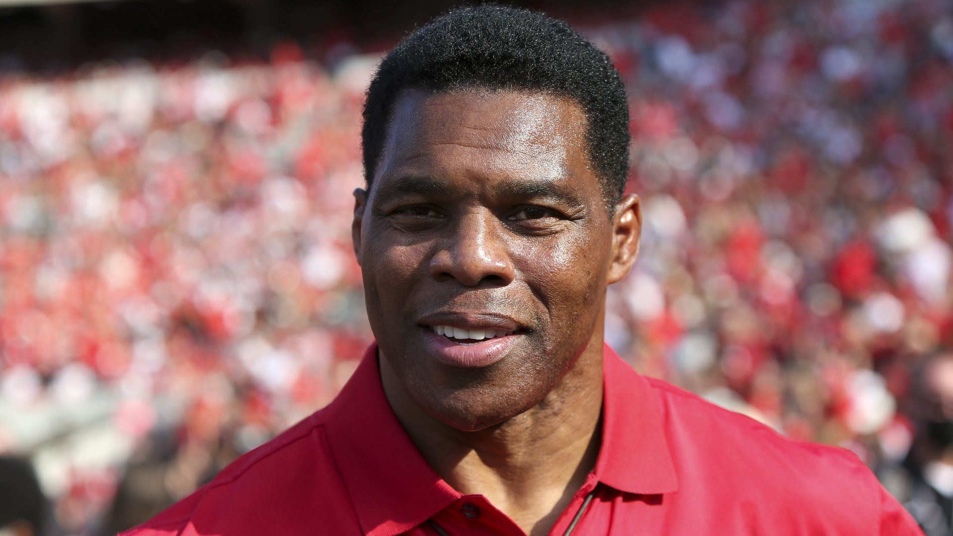 Herschel Walker in a red polo