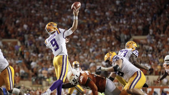 Joe Burrow LSU Tigers Unsigned White Jersey Warming Up At Night Under The  Spotlights Photograph