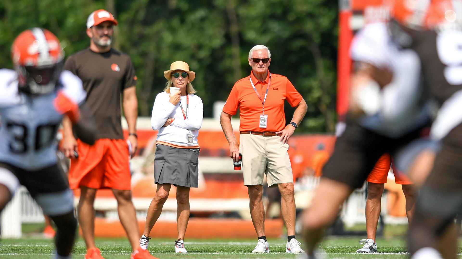 Dee and Jimmy Haslam watch the Cleveland Browns during practice. 