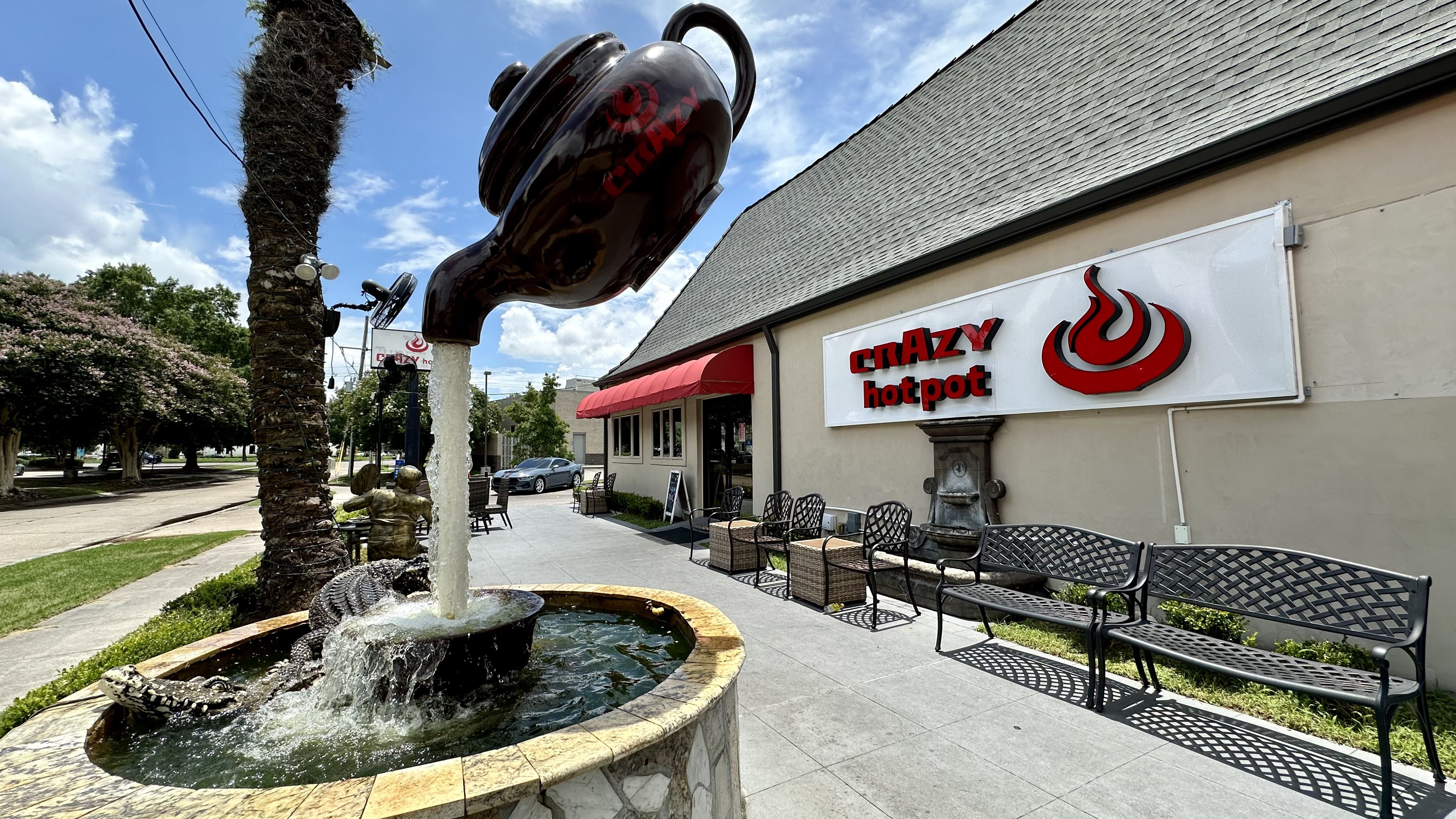 Image shows a teapot fountain outside a restaurant.