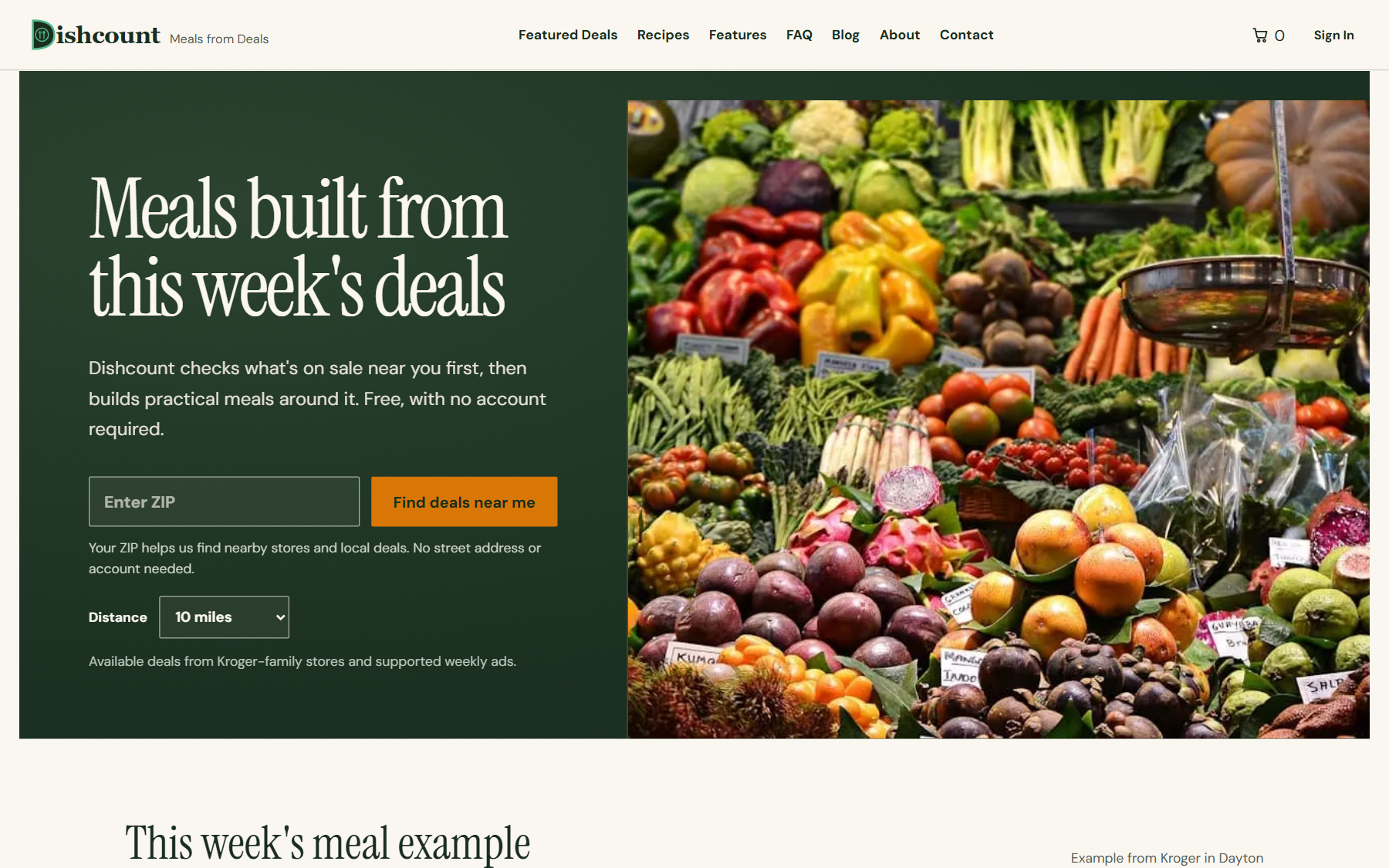 Hero banner with a dark green left panel and large white text 'Meals built from this week's deals' and a ZIP search field; right side shows a colorful market display of vegetables and fruits.