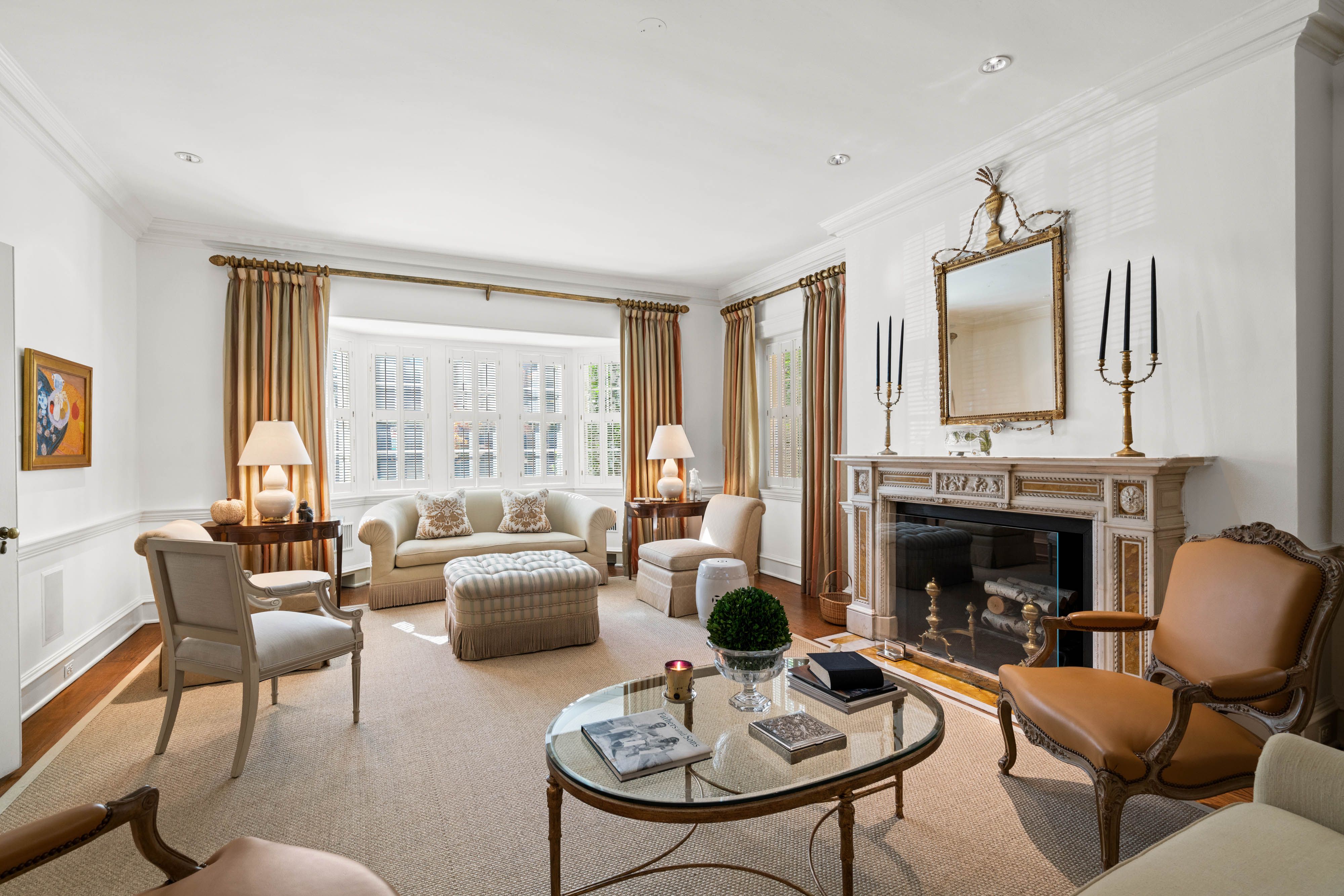 A photo of a living room with a fireplace.